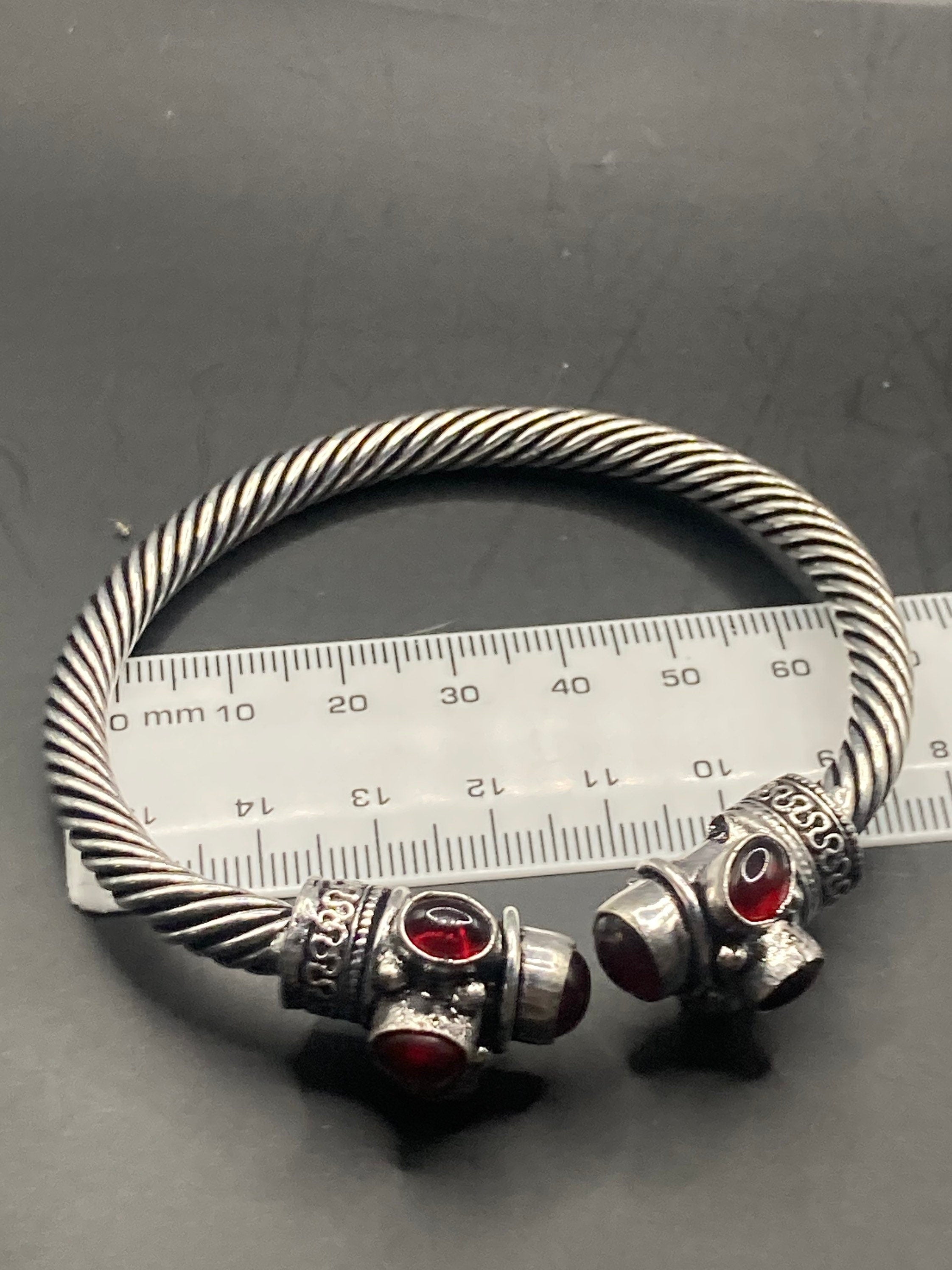 silver tone metal torque cuff bangle bracelet ruby red garnet glass stones