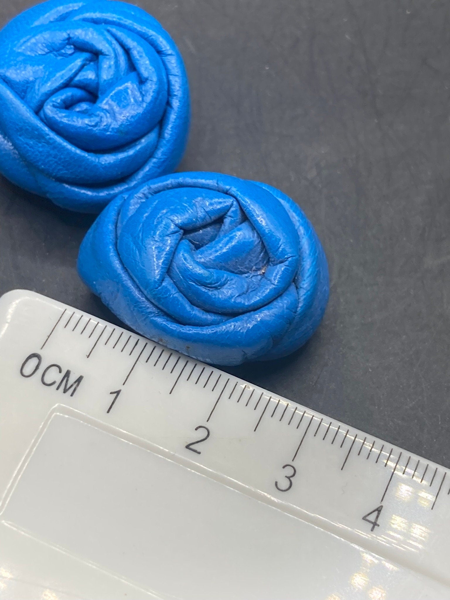 Vintage soft Leather pair of bright blue flower twist shoe clips 1980s