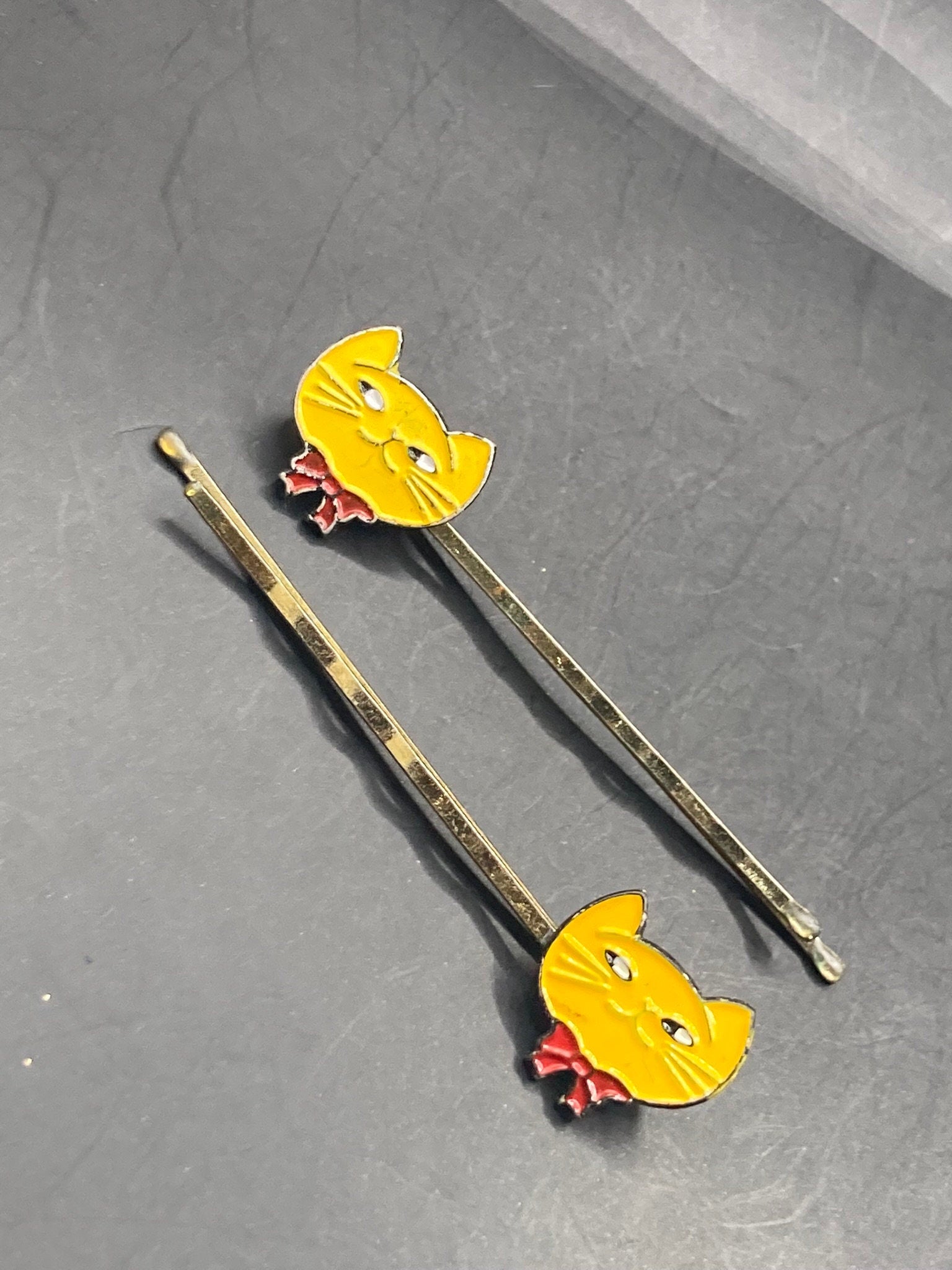 Pair yellow enamel cat girls hair slides