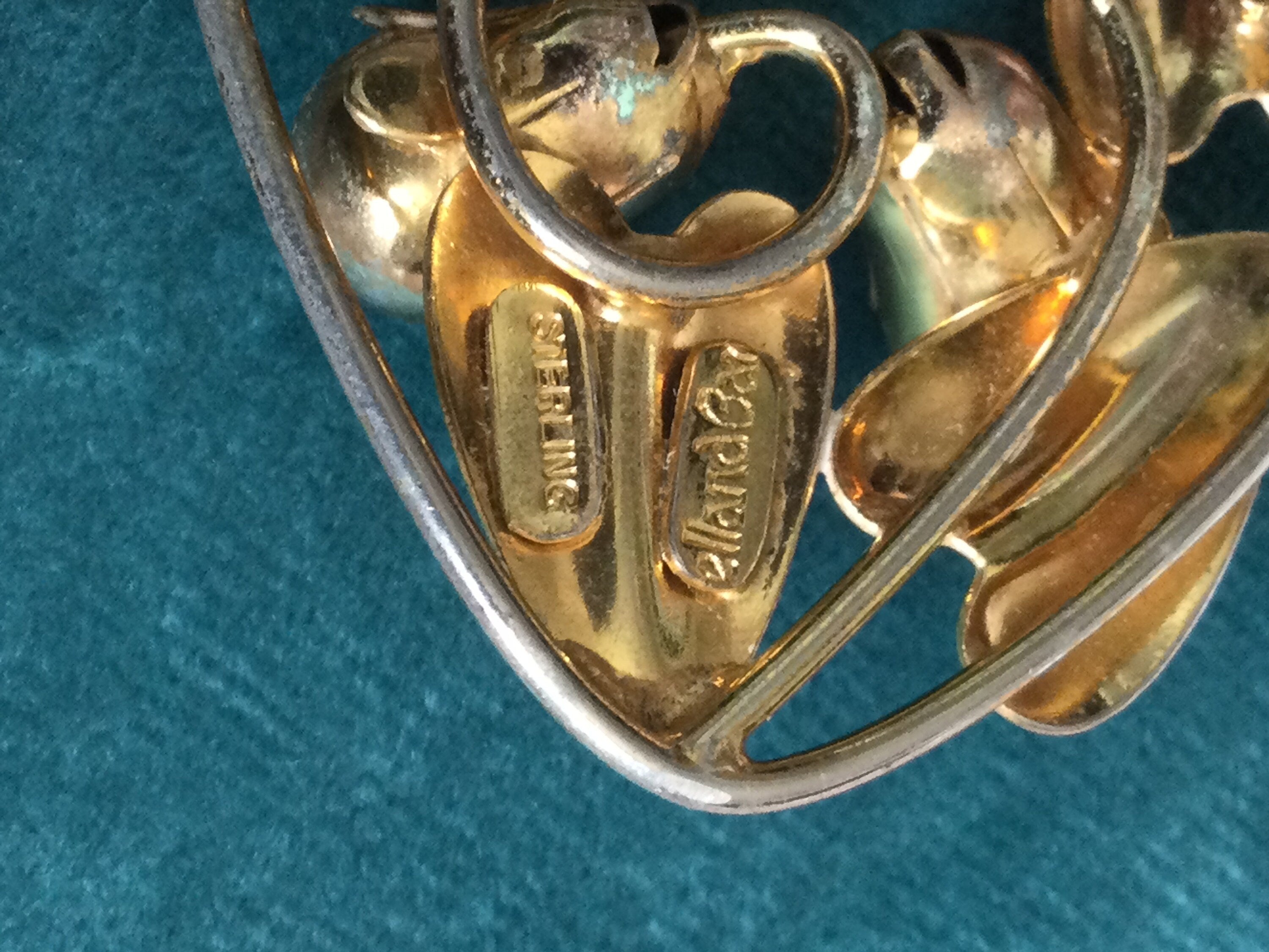 Signed McClelland Barclay 925 sterling silver embossed flower brooch