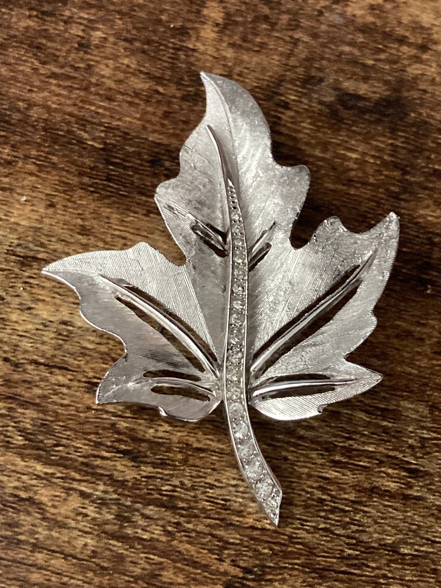 HOLLYWOOD signed silver diamanté paste maple leaf brooch