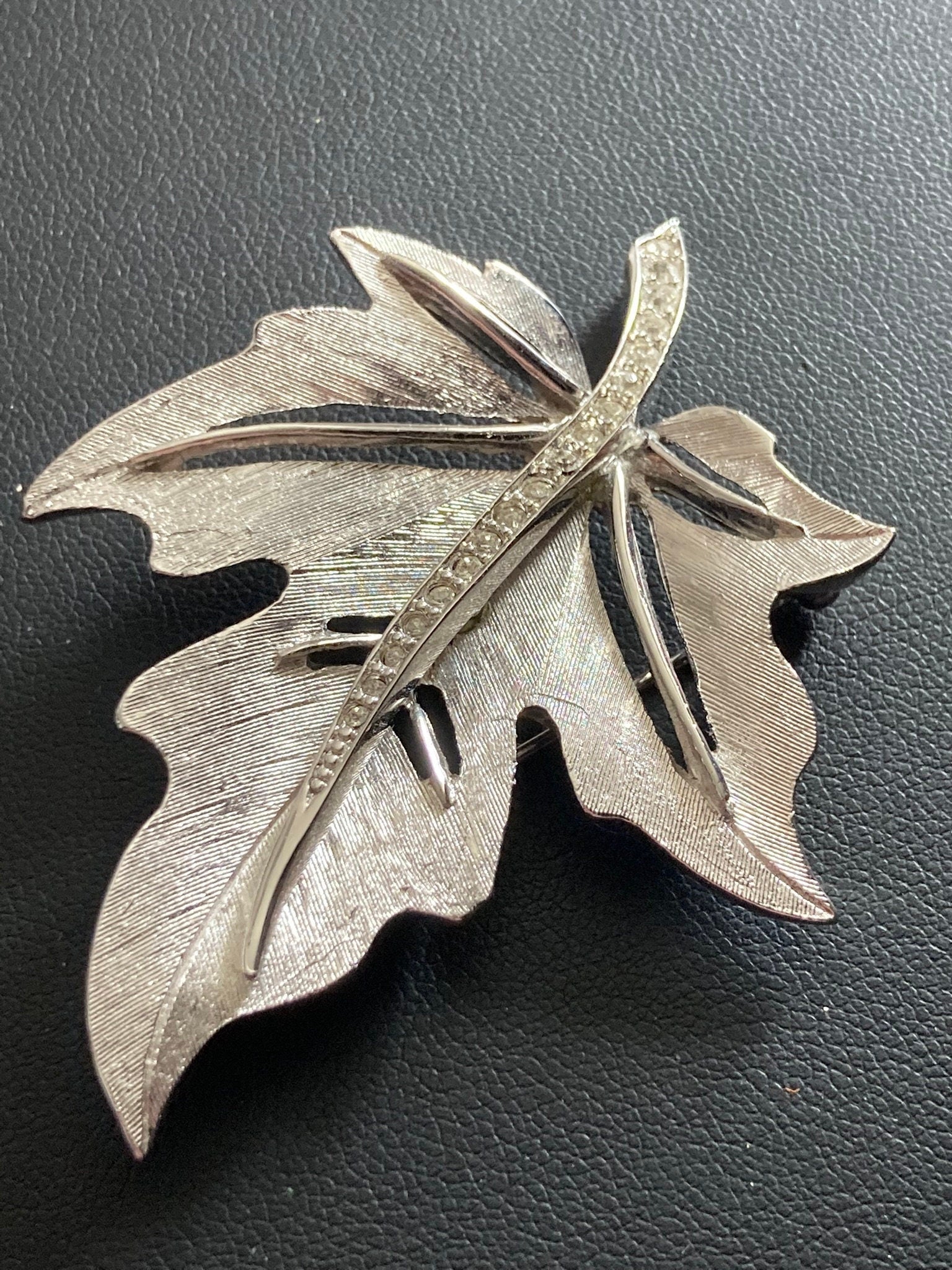 HOLLYWOOD signed silver diamanté paste maple leaf brooch