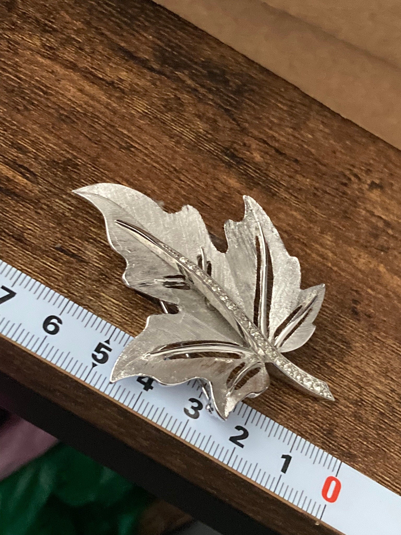 HOLLYWOOD signed silver diamanté paste maple leaf brooch