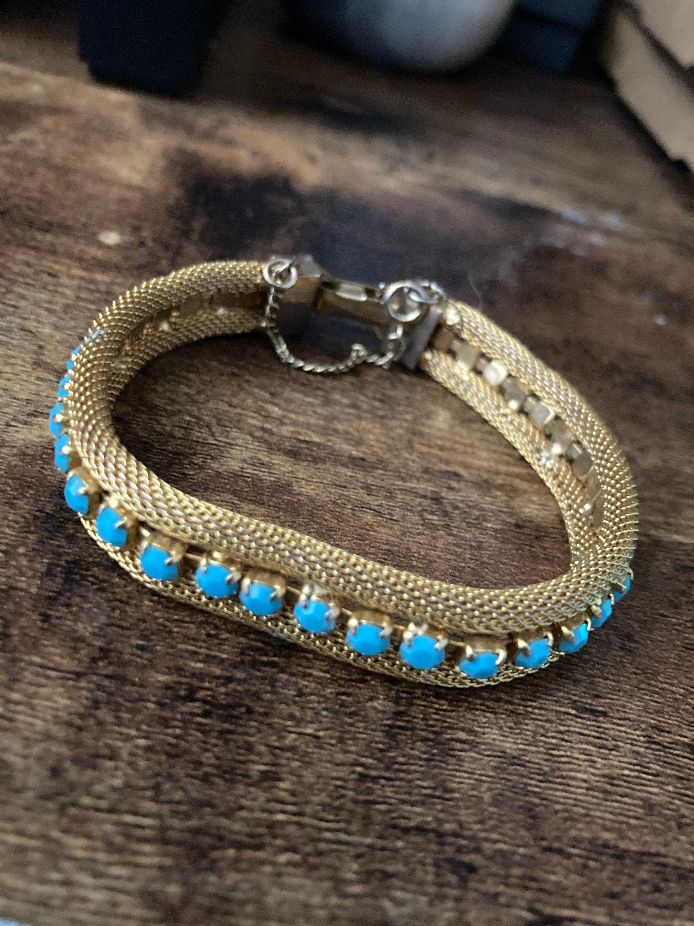 Vintage gold tone cuff bracelet with turquoise blue paste