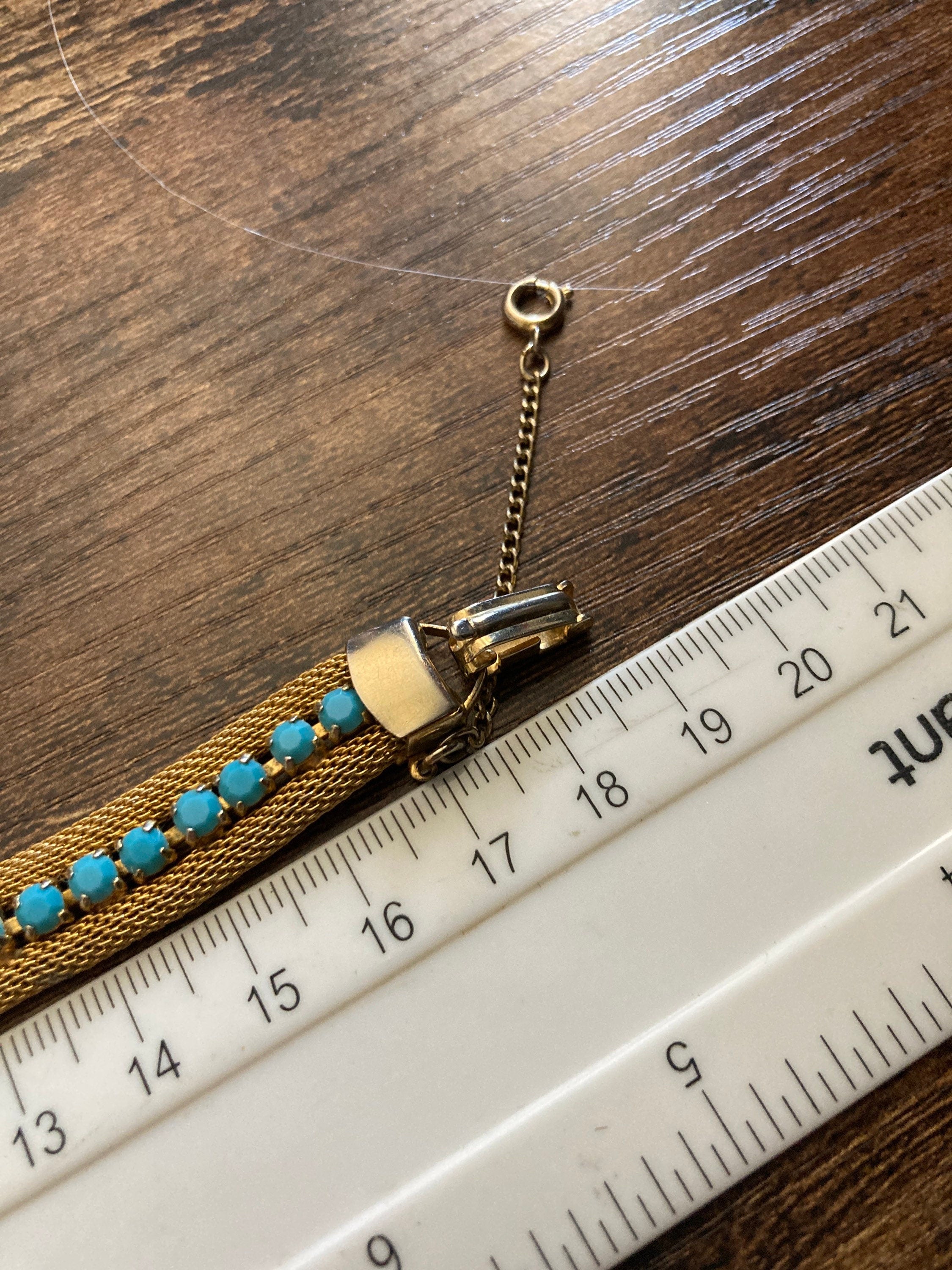 Vintage gold tone cuff bracelet with turquoise blue paste