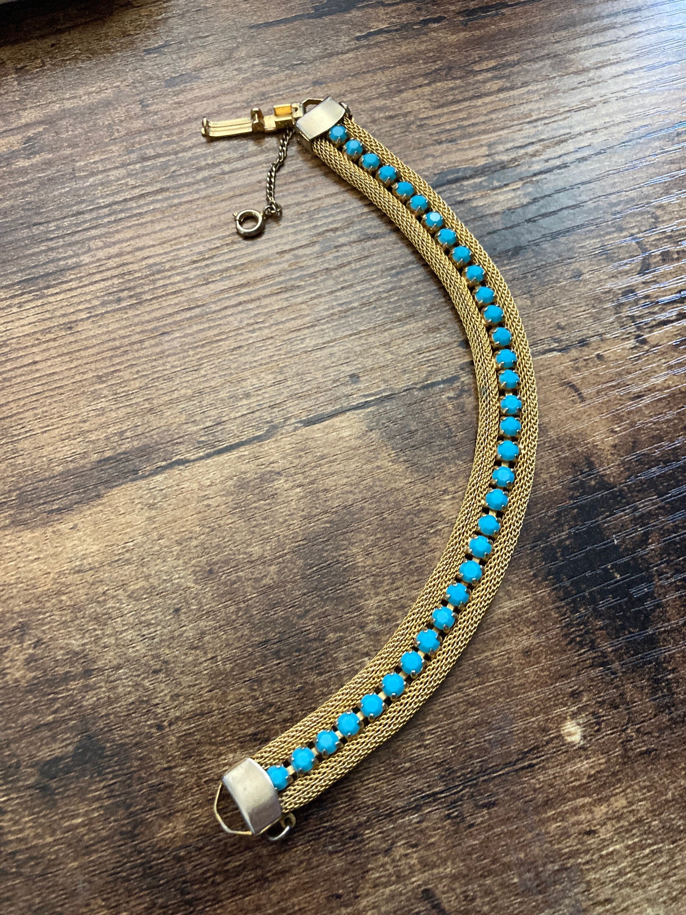 Vintage gold tone cuff bracelet with turquoise blue paste