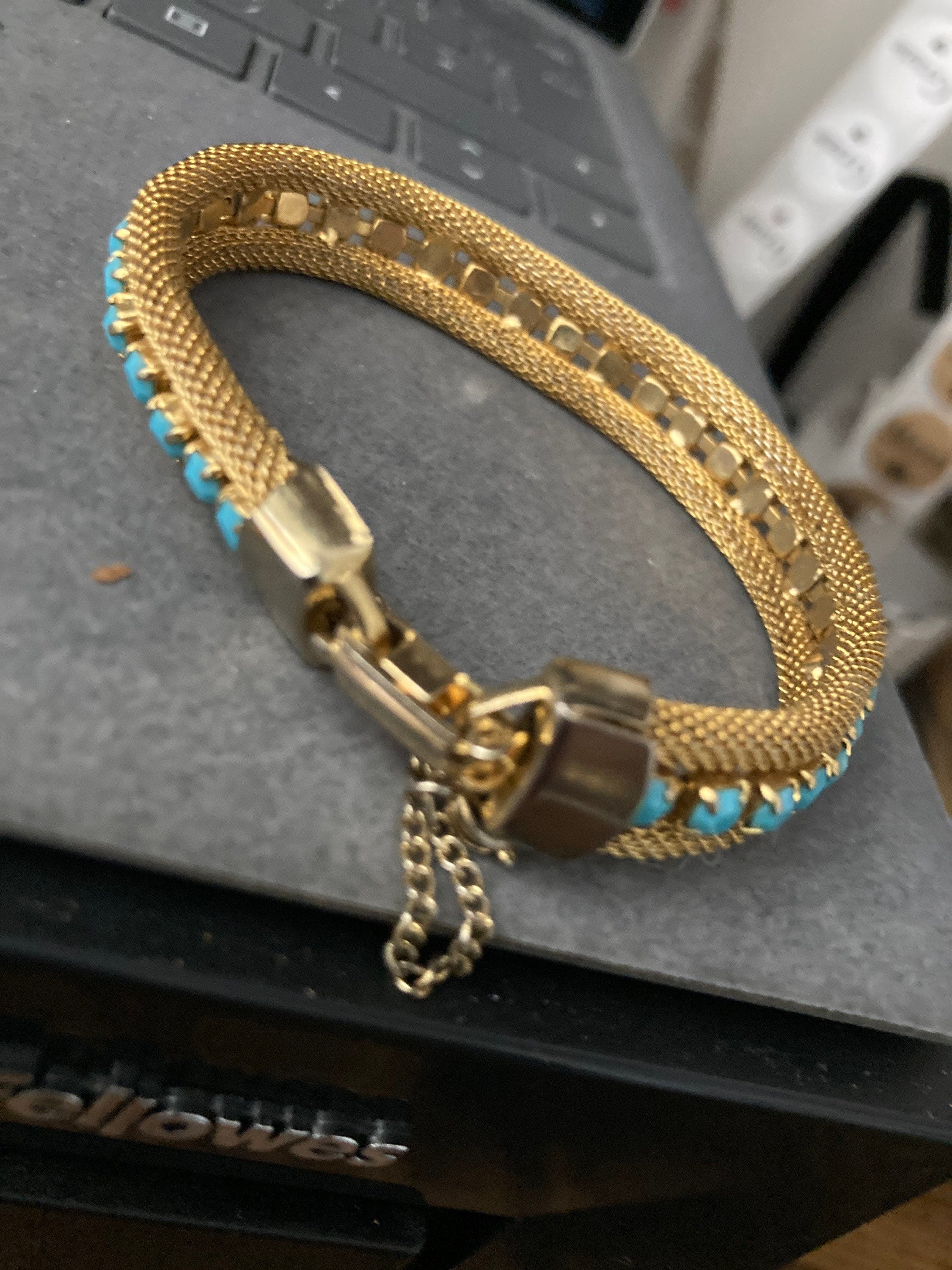 Vintage gold tone cuff bracelet with turquoise blue paste