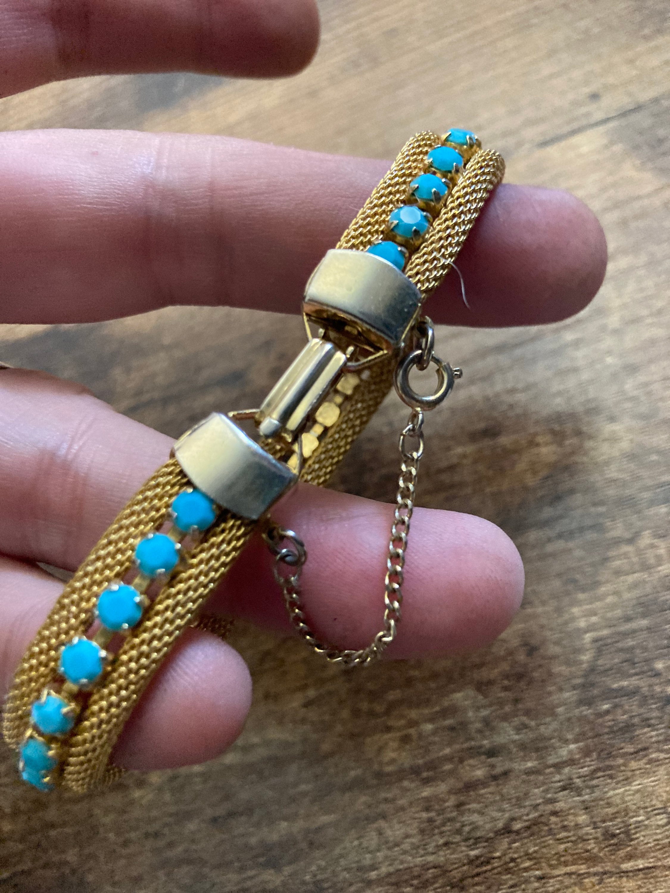 Vintage gold tone cuff bracelet with turquoise blue paste
