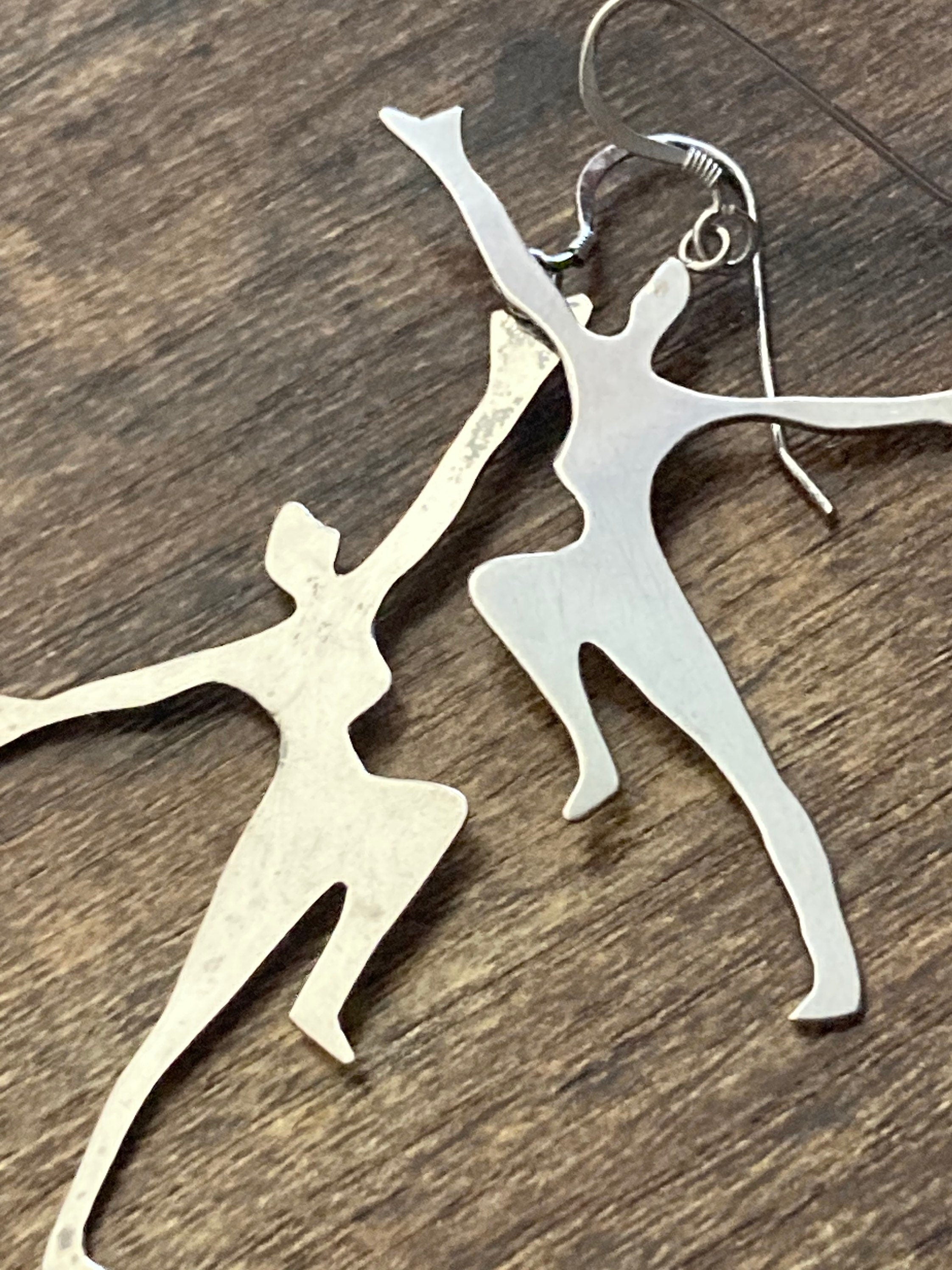 Unmarked silver 7cm long Art Deco dancing lady drop earrings pierced ears white metal
