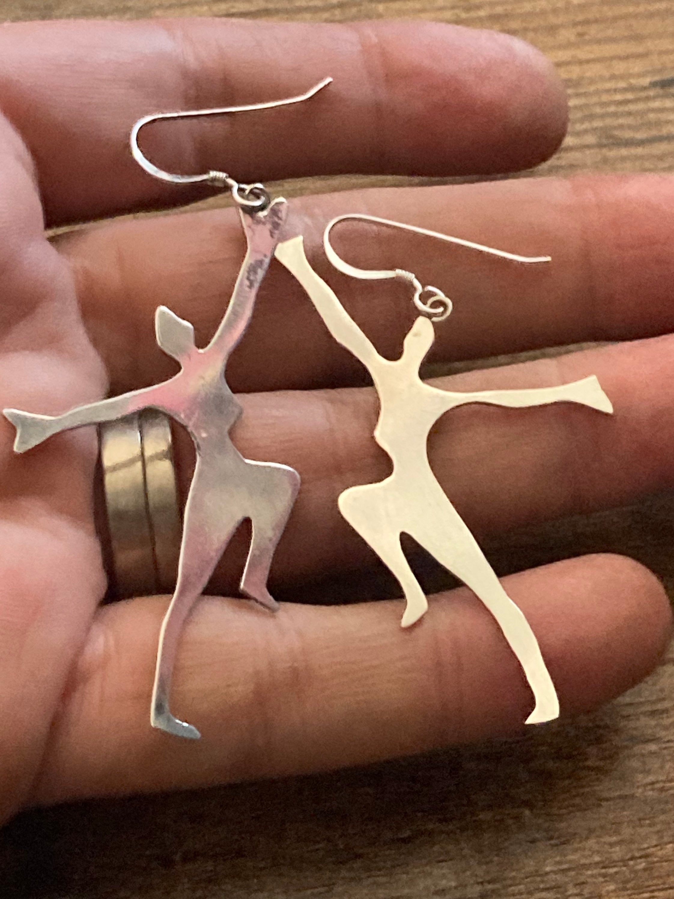 Unmarked silver 7cm long Art Deco dancing lady drop earrings pierced ears white metal