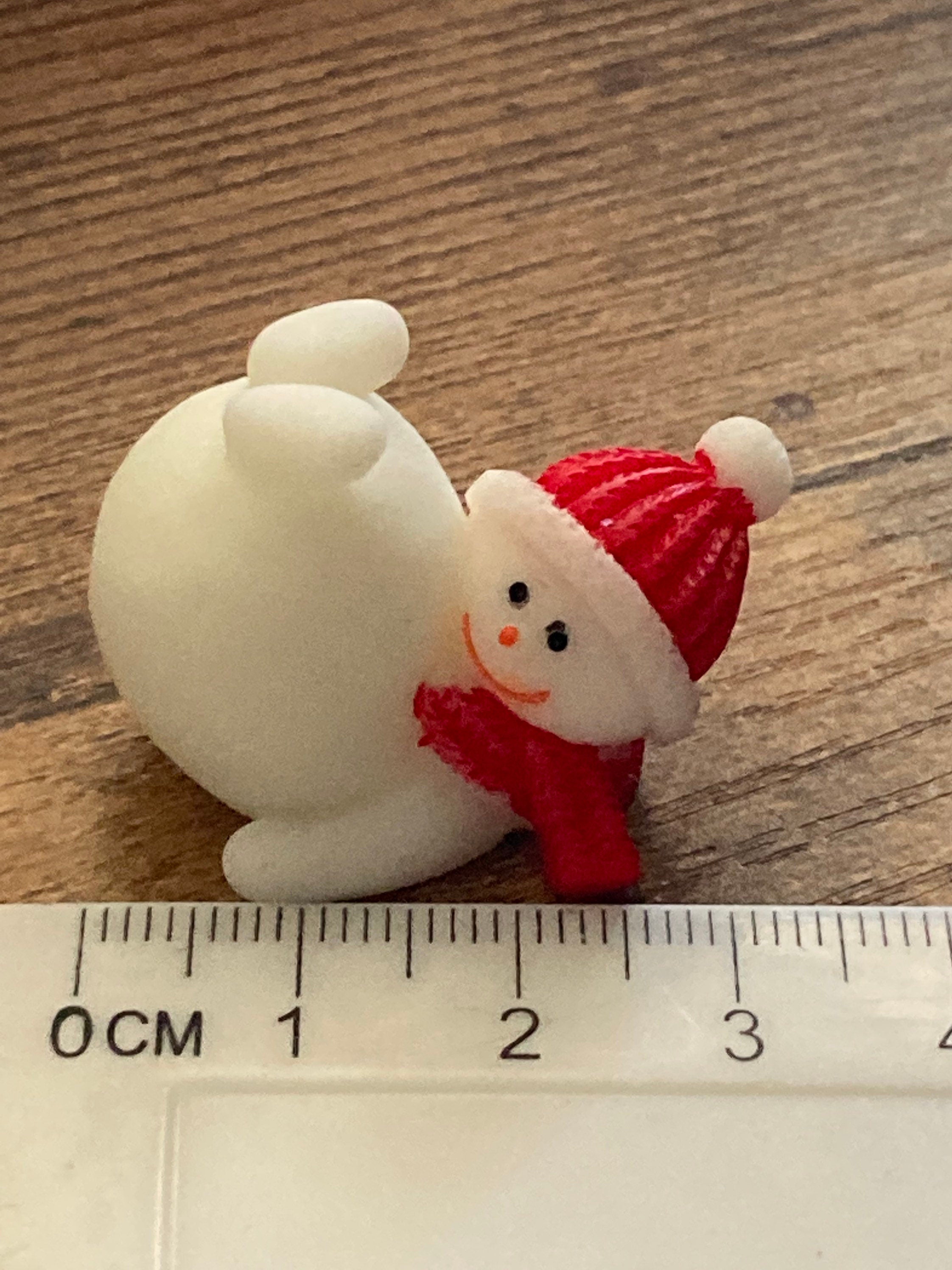 Cute tumbling snowman cake topper in plastic Christmas