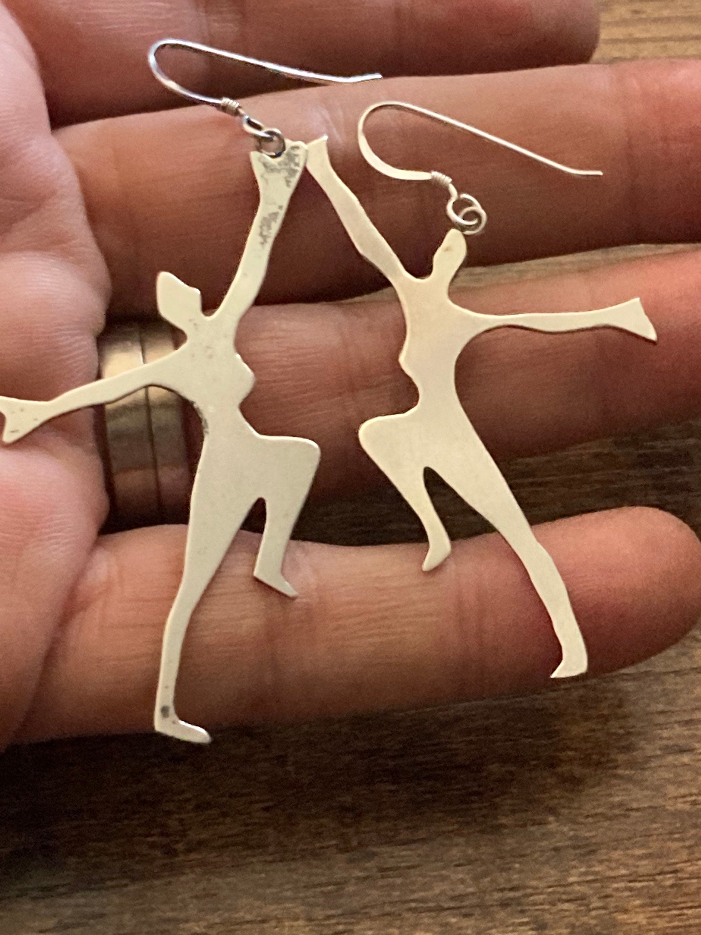 Unmarked silver 7cm long Art Deco dancing lady drop earrings pierced ears white metal