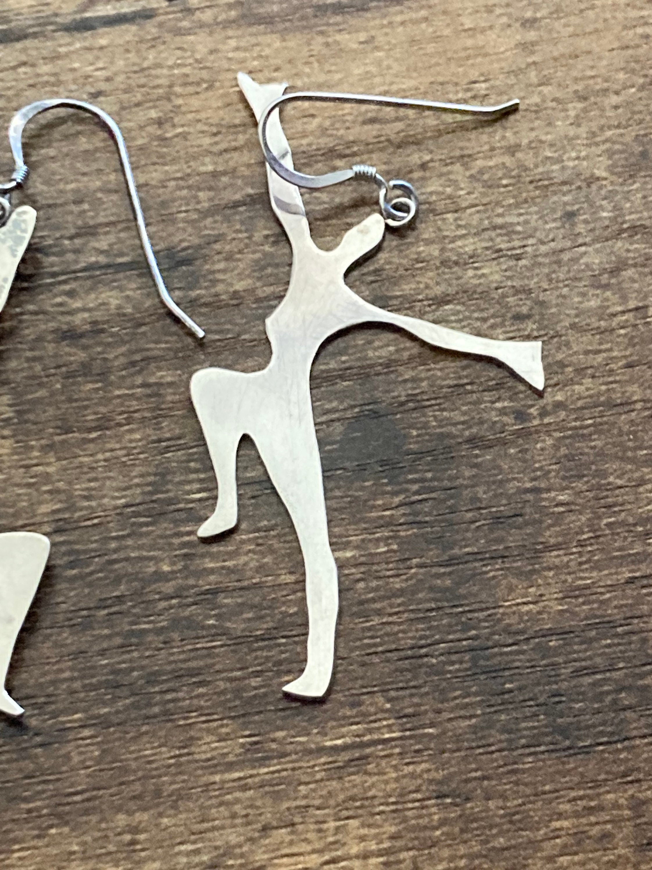 Unmarked silver 7cm long Art Deco dancing lady drop earrings pierced ears white metal