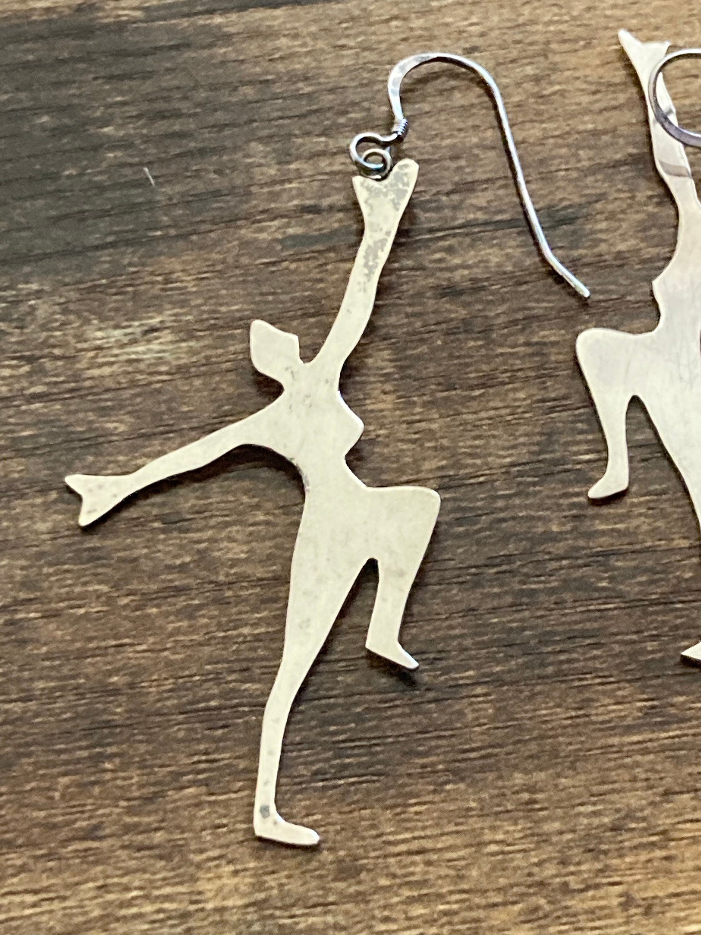 Unmarked silver 7cm long Art Deco dancing lady drop earrings pierced ears white metal