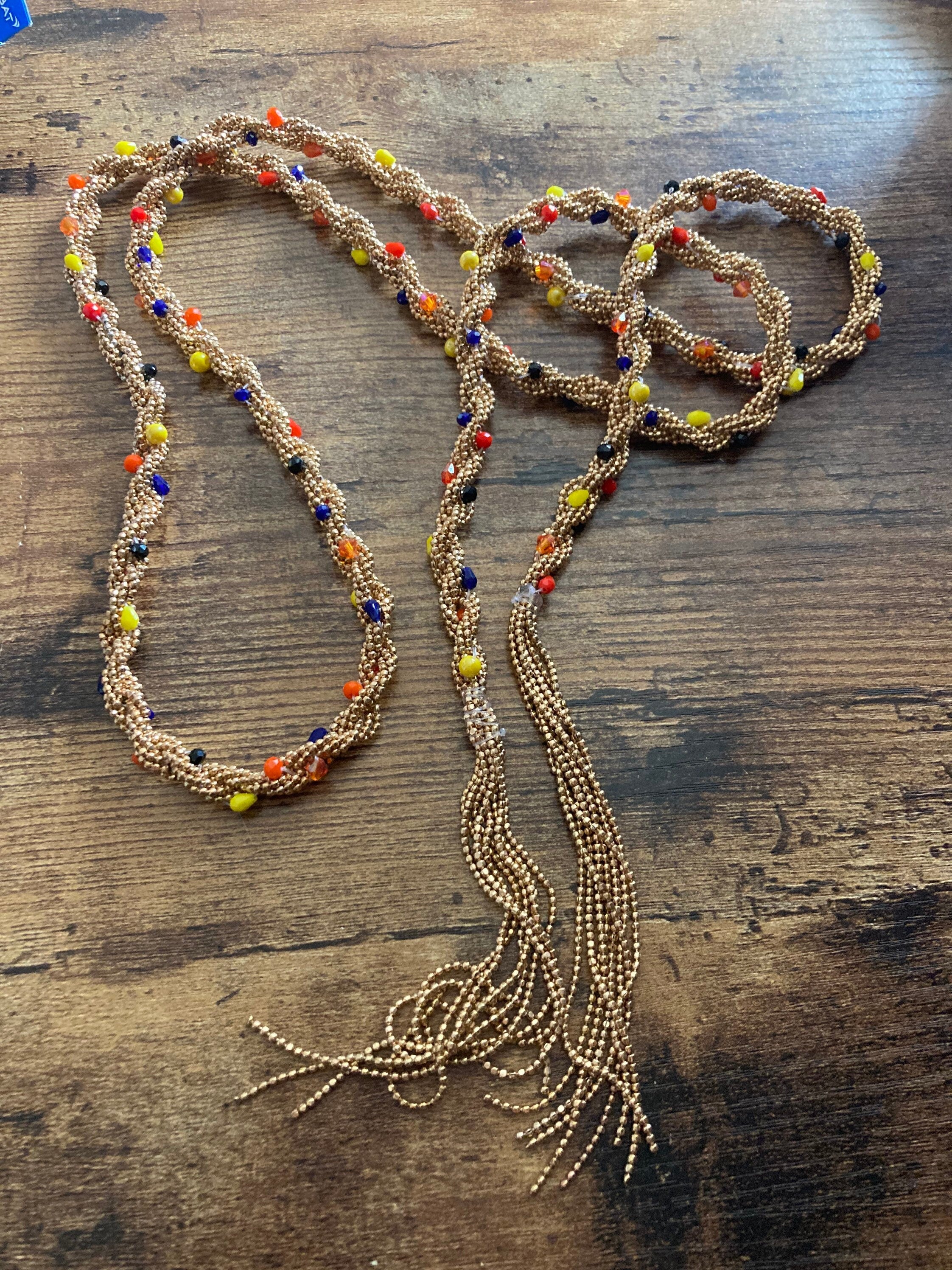 140cm long gold tone tassel necklace with orange yellow woven seed bead flapper length