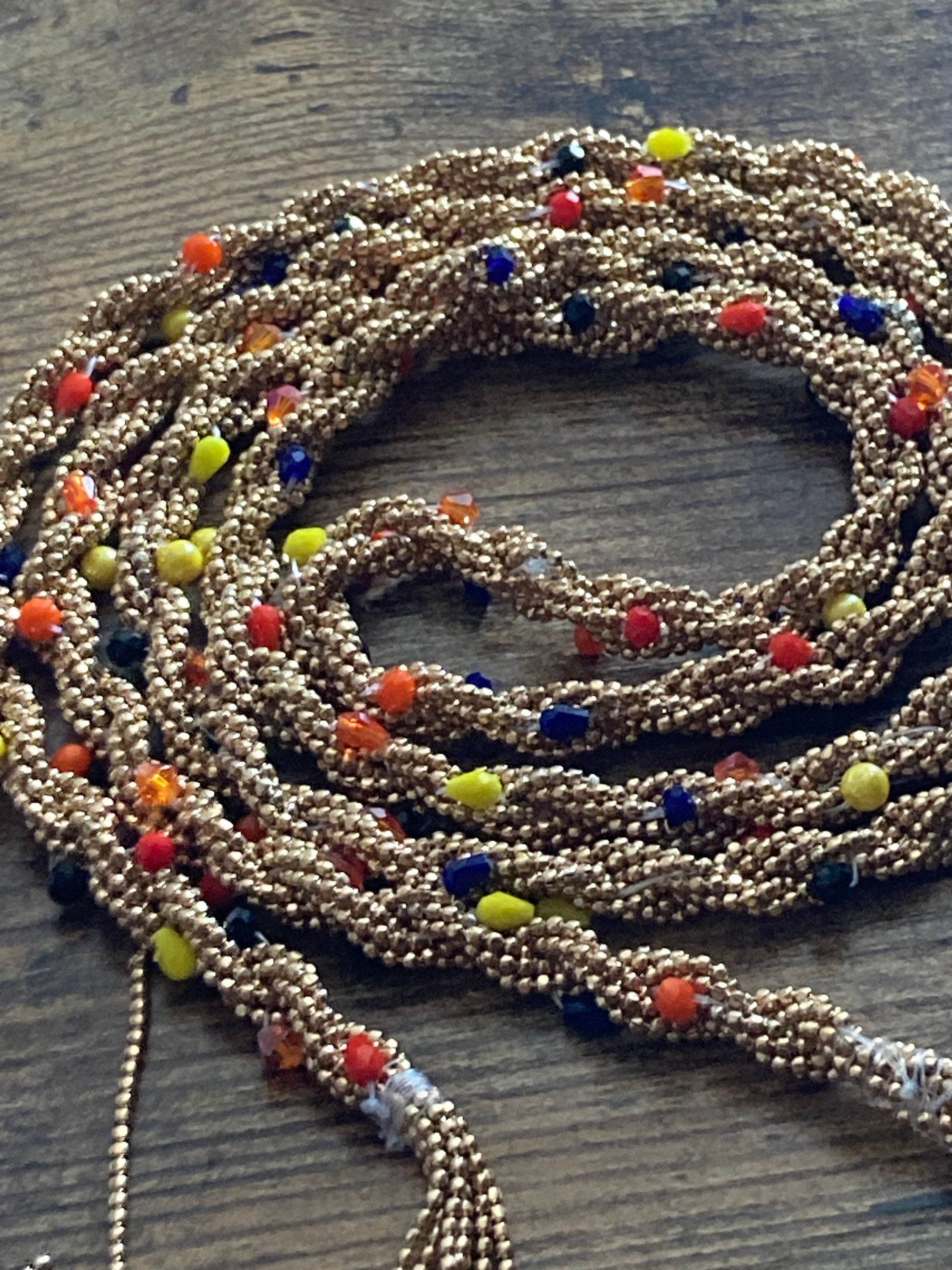 140cm long gold tone tassel necklace with orange yellow woven seed bead flapper length