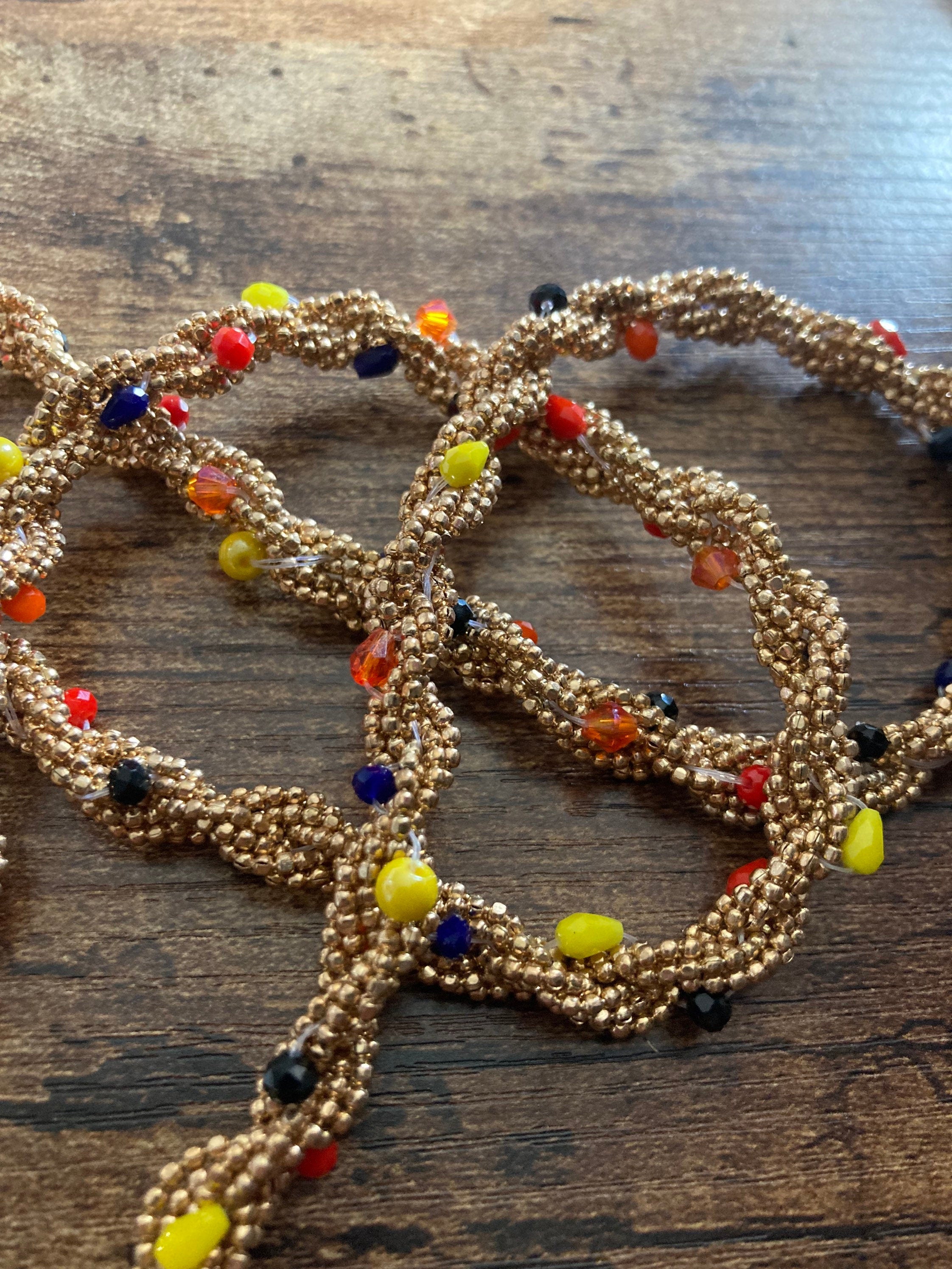 140cm long gold tone tassel necklace with orange yellow woven seed bead flapper length