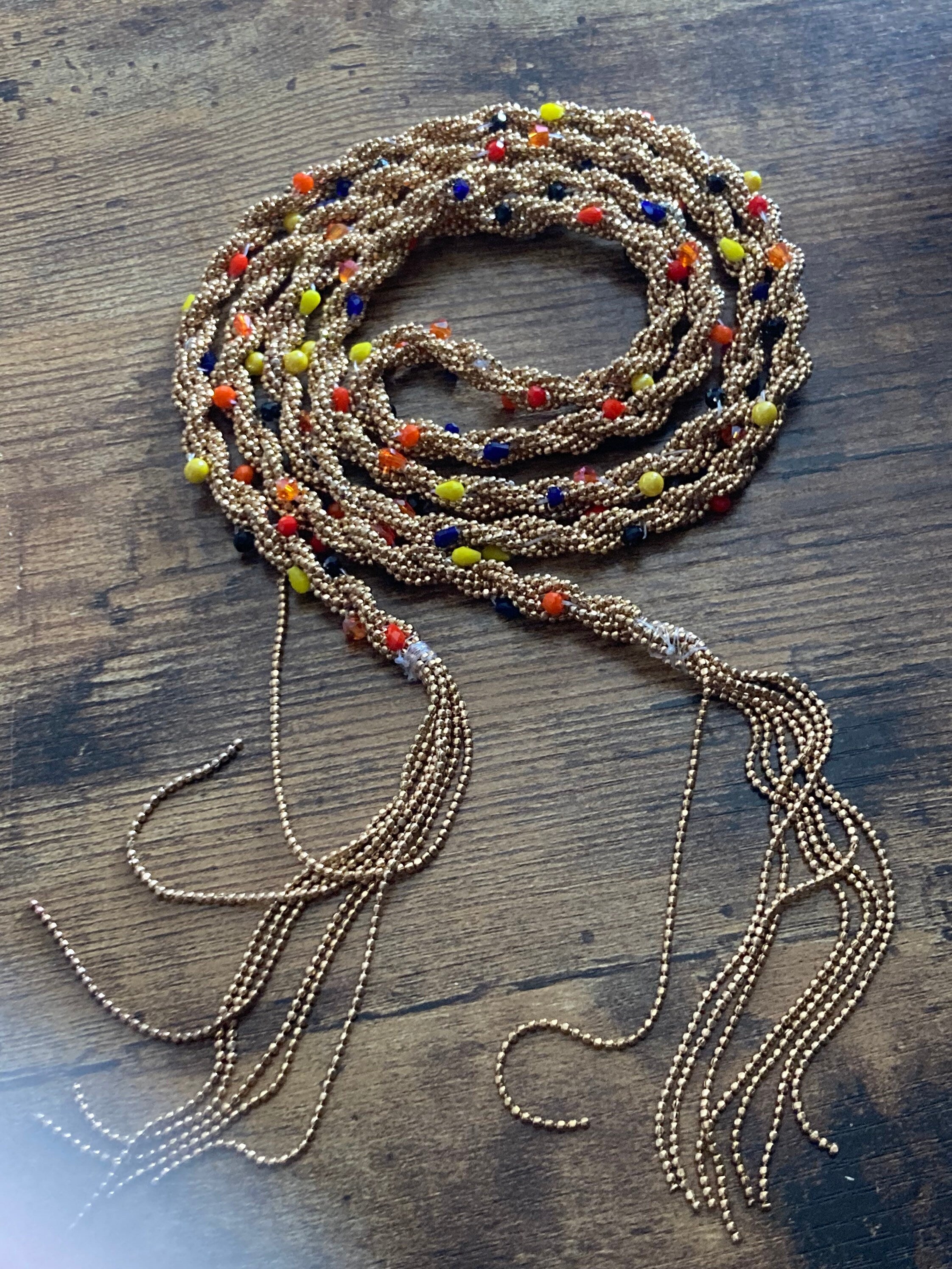 140cm long gold tone tassel necklace with orange yellow woven seed bead flapper length