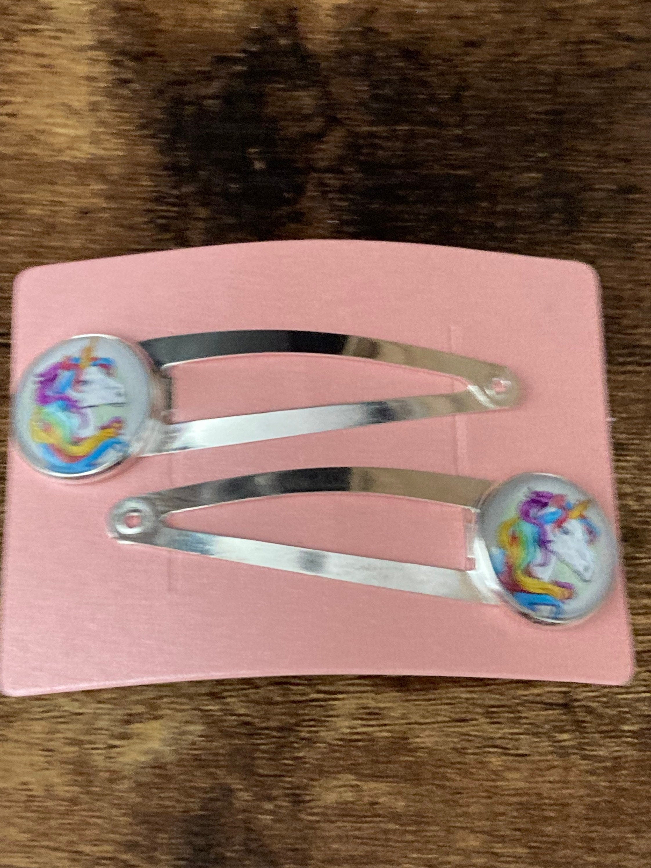 pair of Unicorn hair clips silver tone snap lock closure