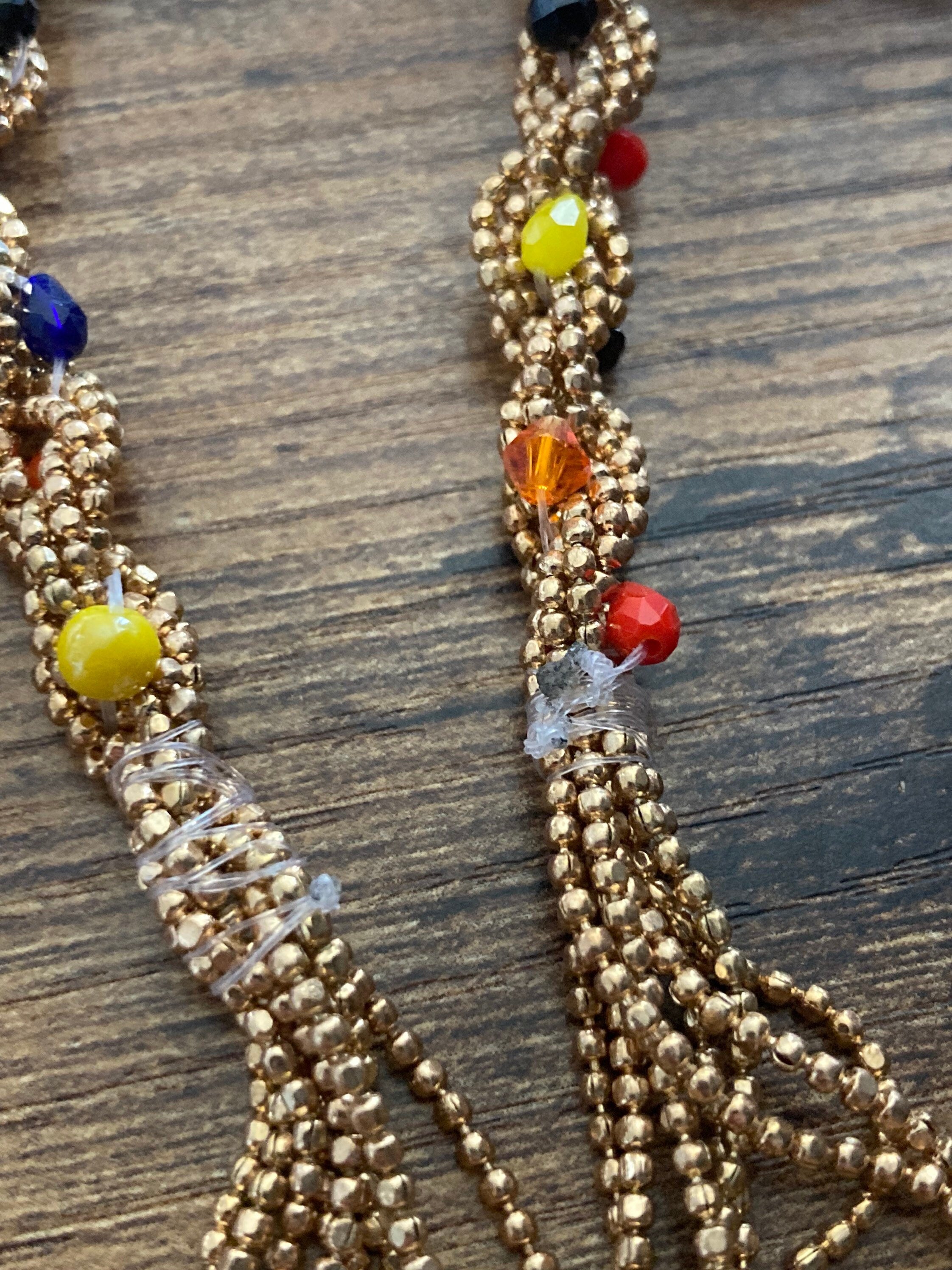 140cm long gold tone tassel necklace with orange yellow woven seed bead flapper length