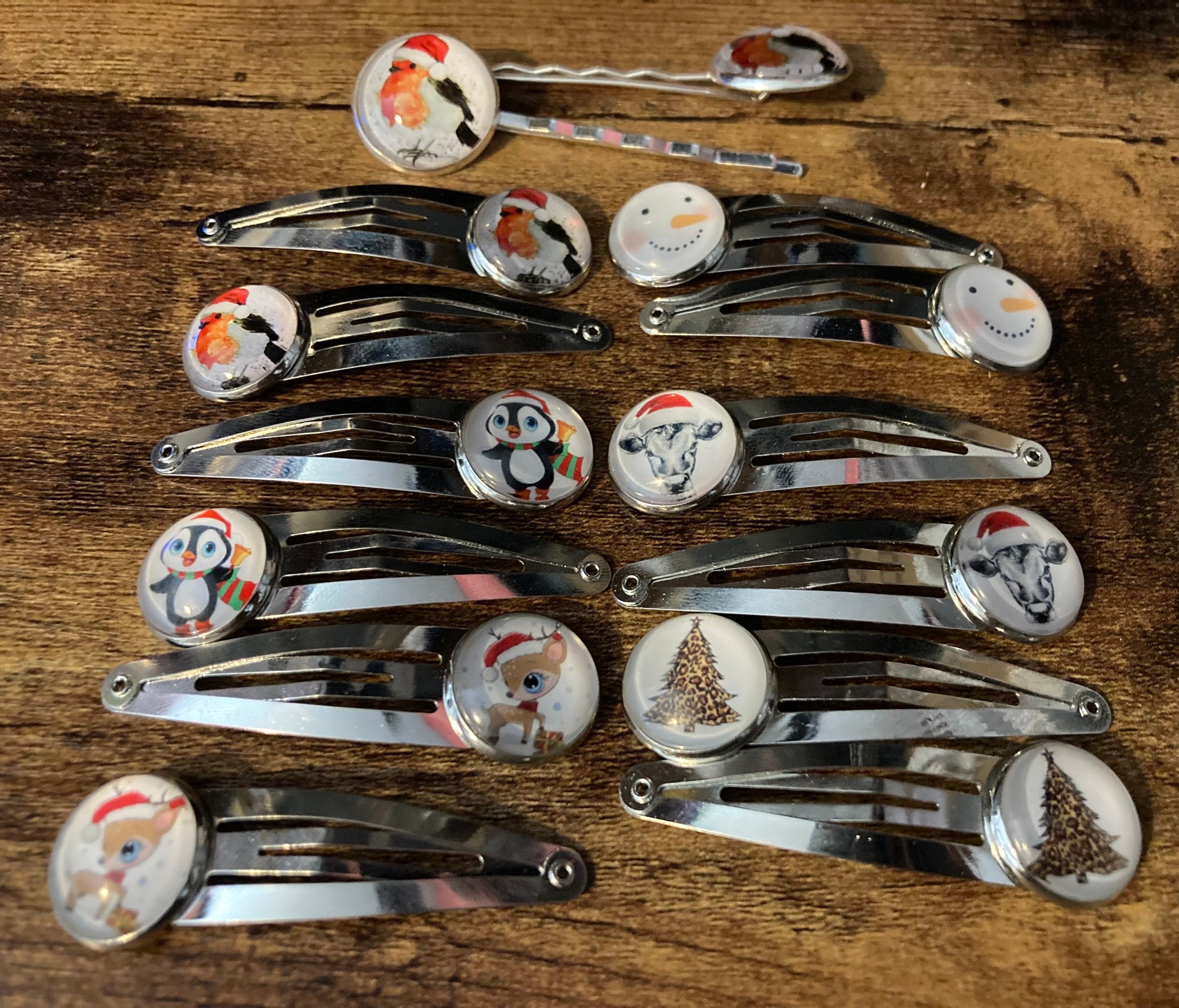 Pair of silver Christmas penguins hair slides