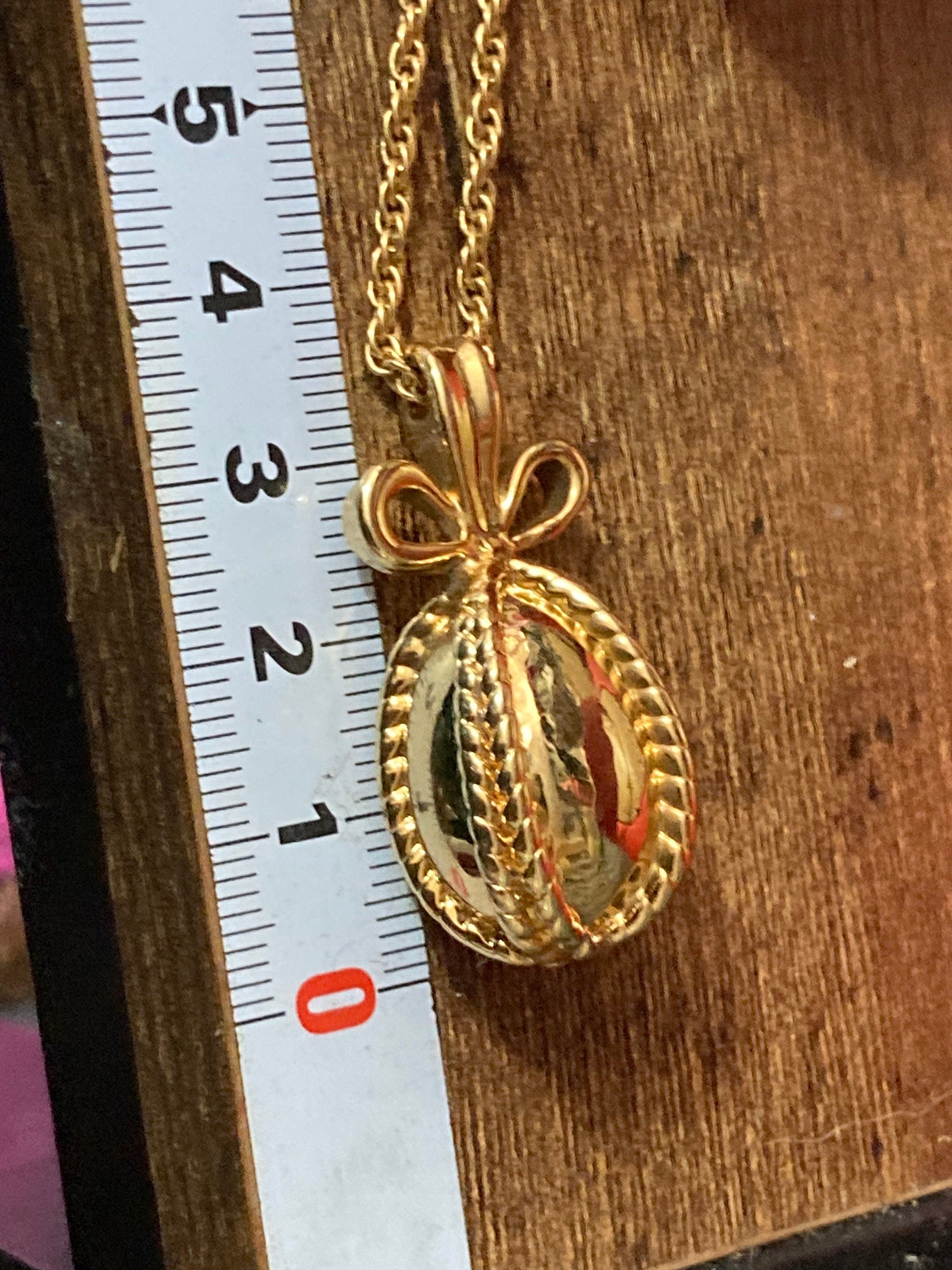 Joan Rivers Gold Faberge inspired bow egg pendant necklace on 75cm rope chain