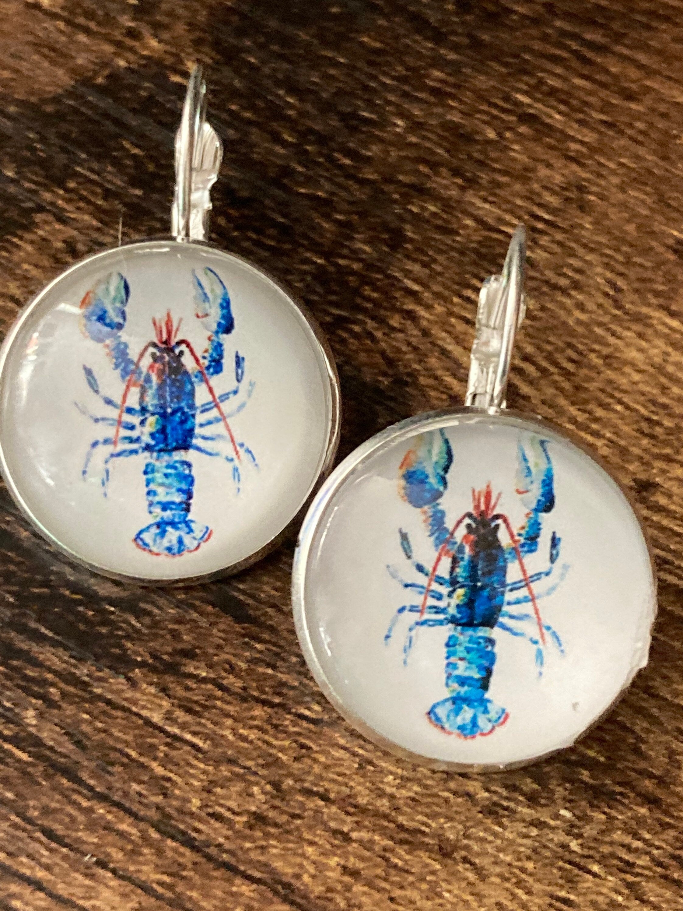 Silver tone Blue glass domed lobster earrings