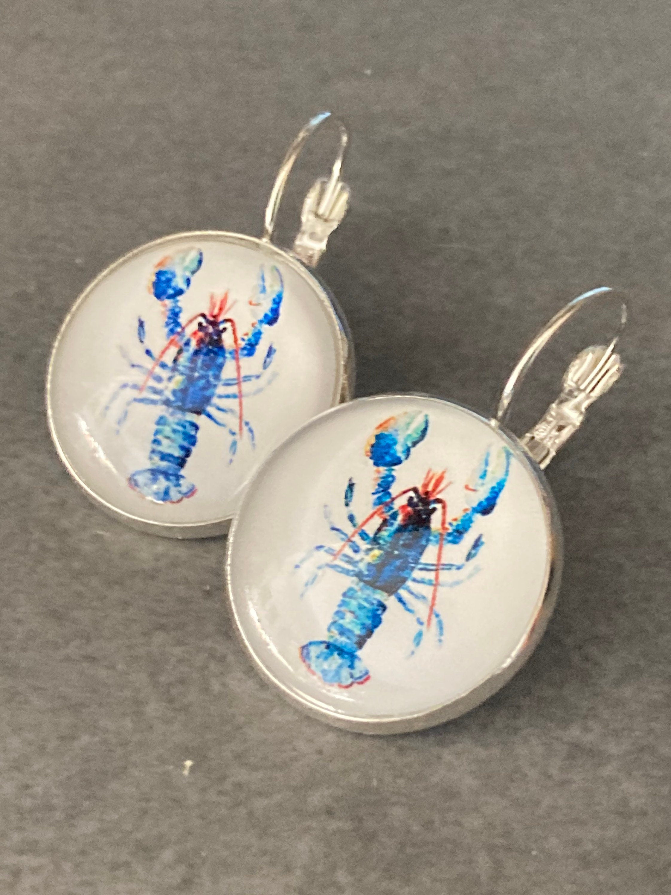 Silver tone Blue glass domed lobster earrings