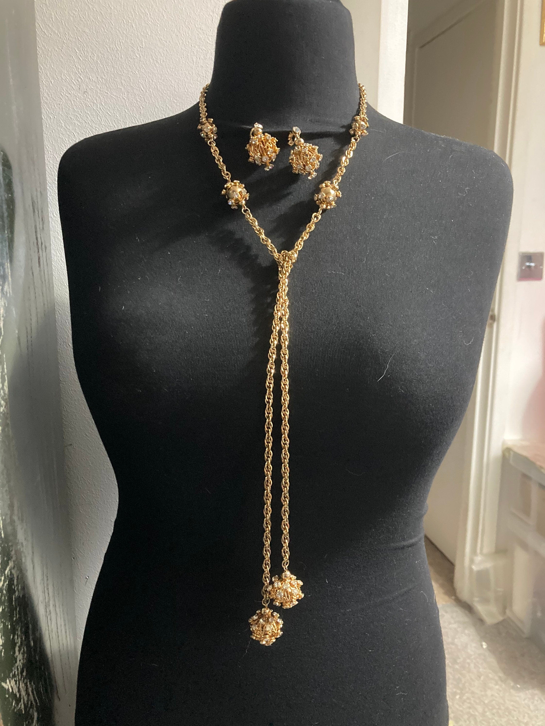 long gold tone rhinestone ball link soutoir knot necklace and matching clip earrings
