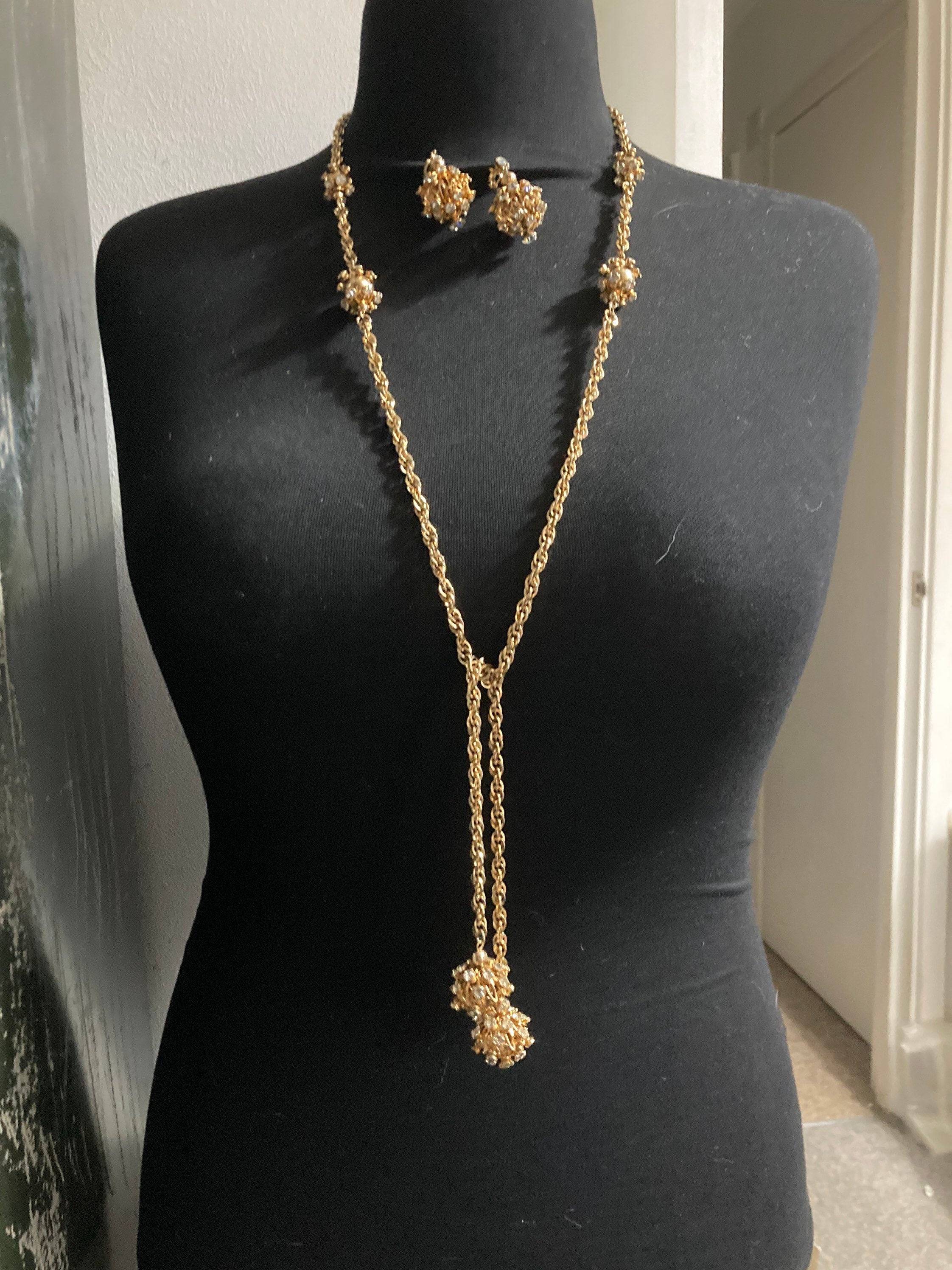 long gold tone rhinestone ball link soutoir knot necklace and matching clip earrings