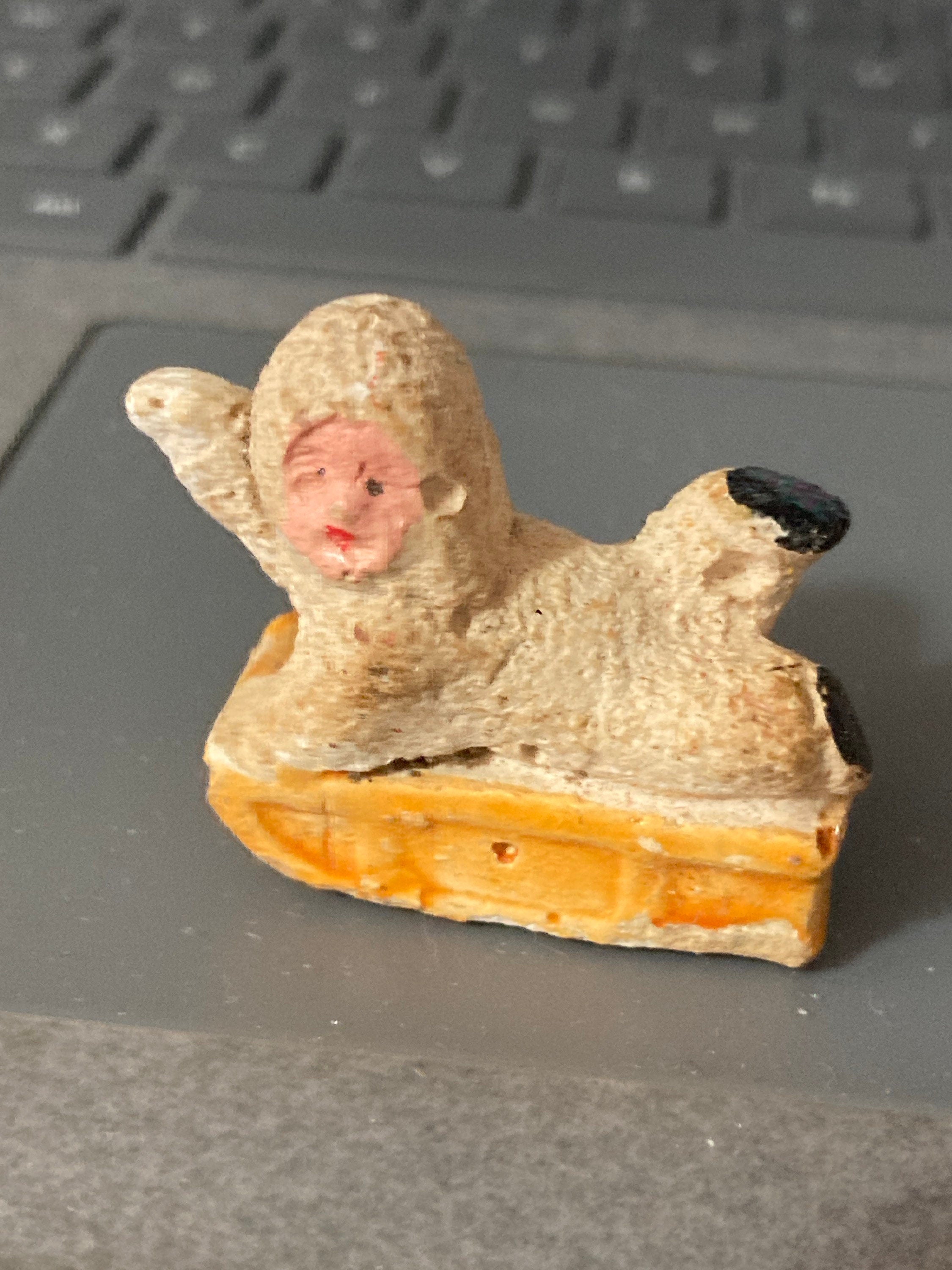 Antique Vintage PLASTER or bisque Snow Baby on sledge Christmas Xmas Cake topper