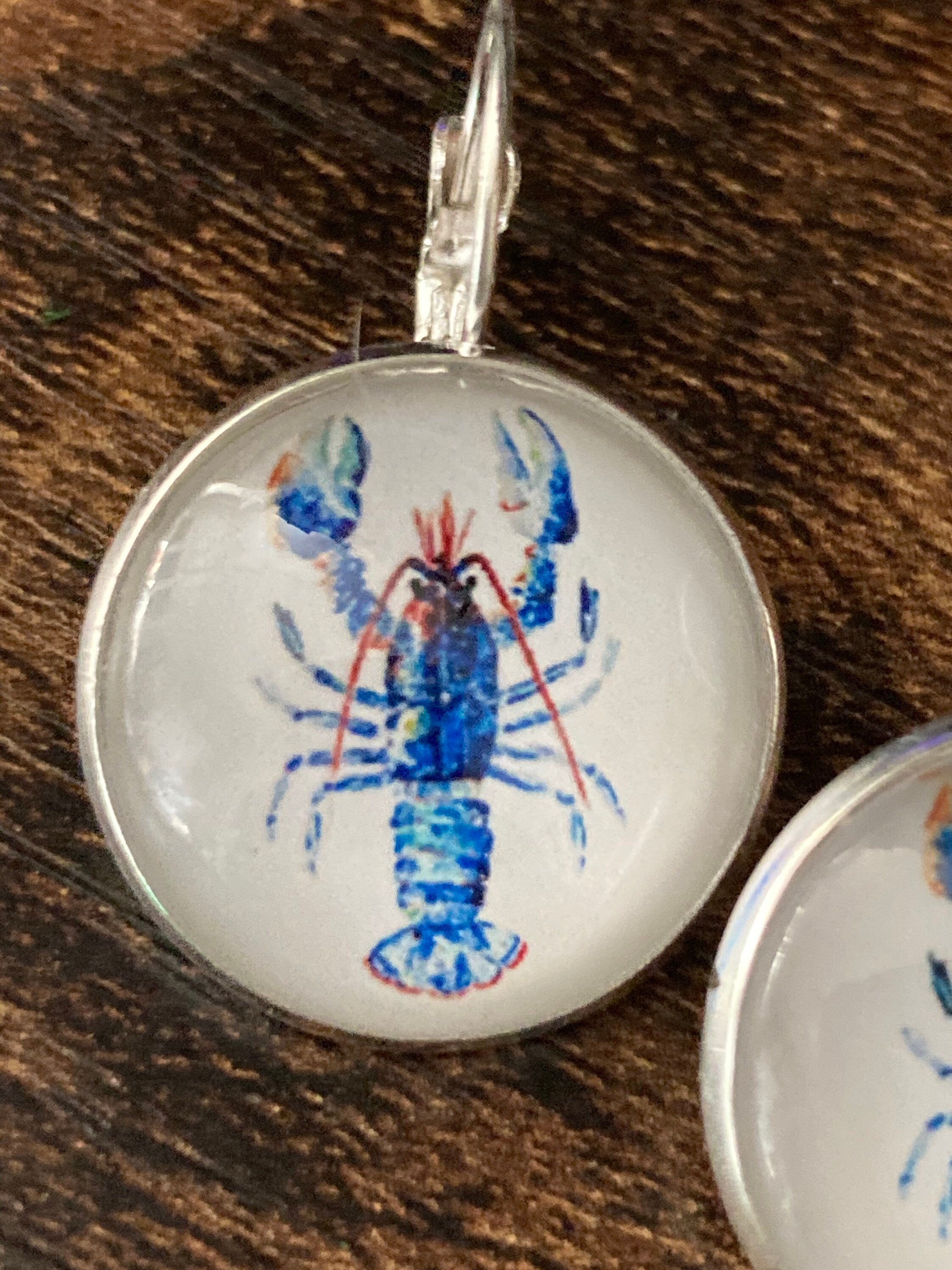 Silver tone Blue glass domed lobster earrings
