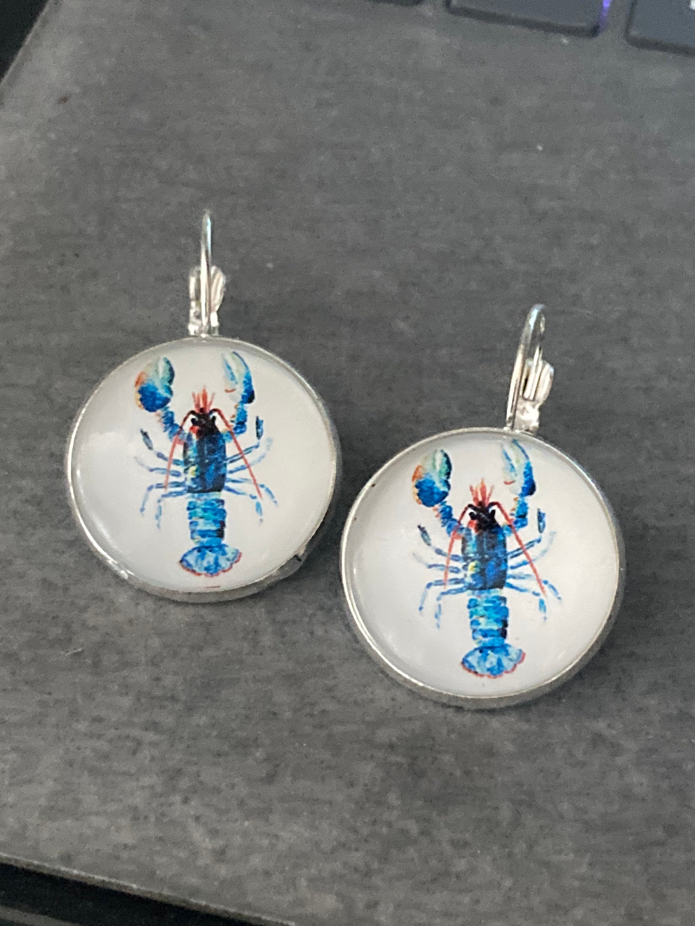 Silver tone Blue glass domed lobster earrings