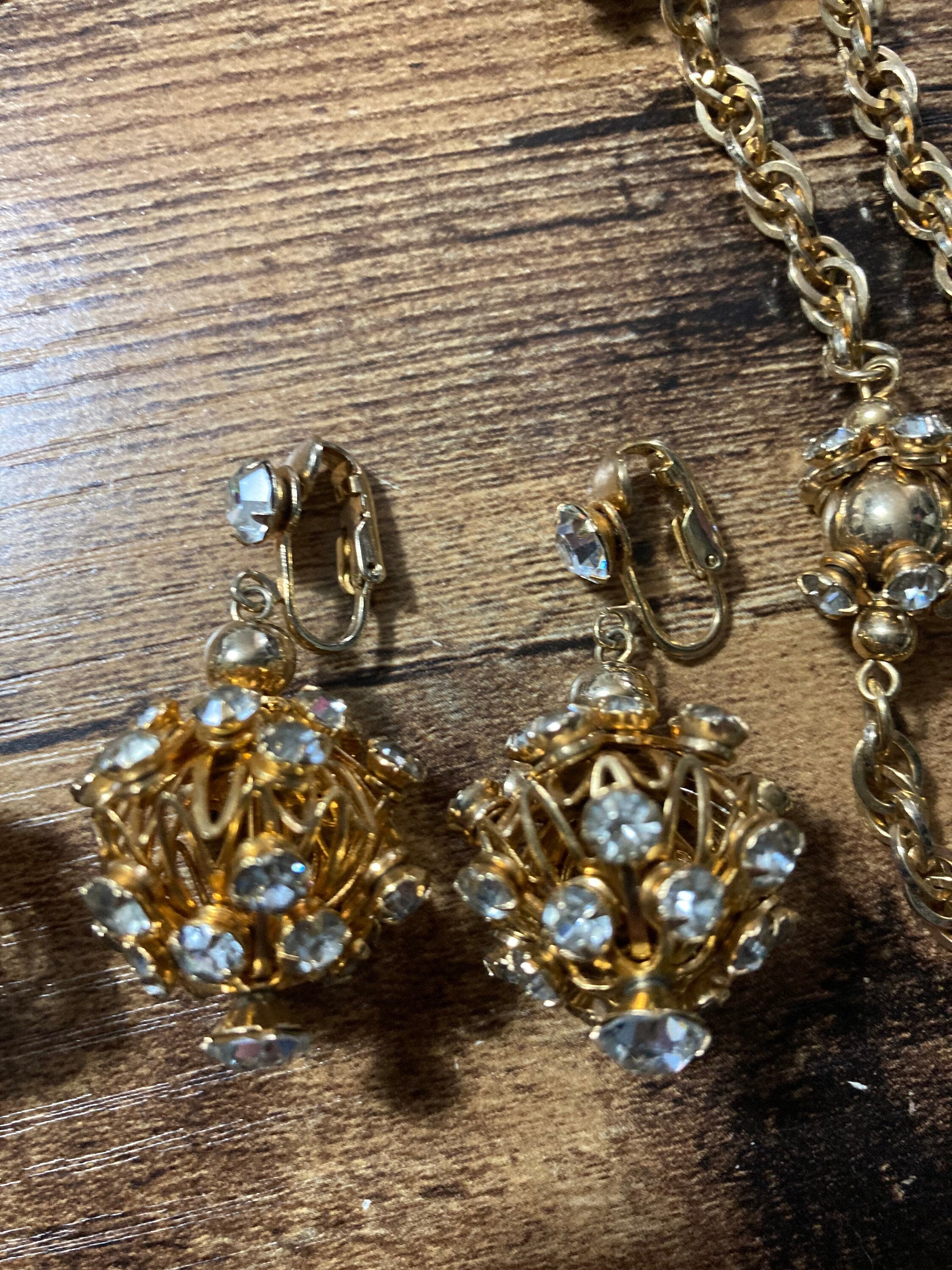 long gold tone rhinestone ball link soutoir knot necklace and matching clip earrings