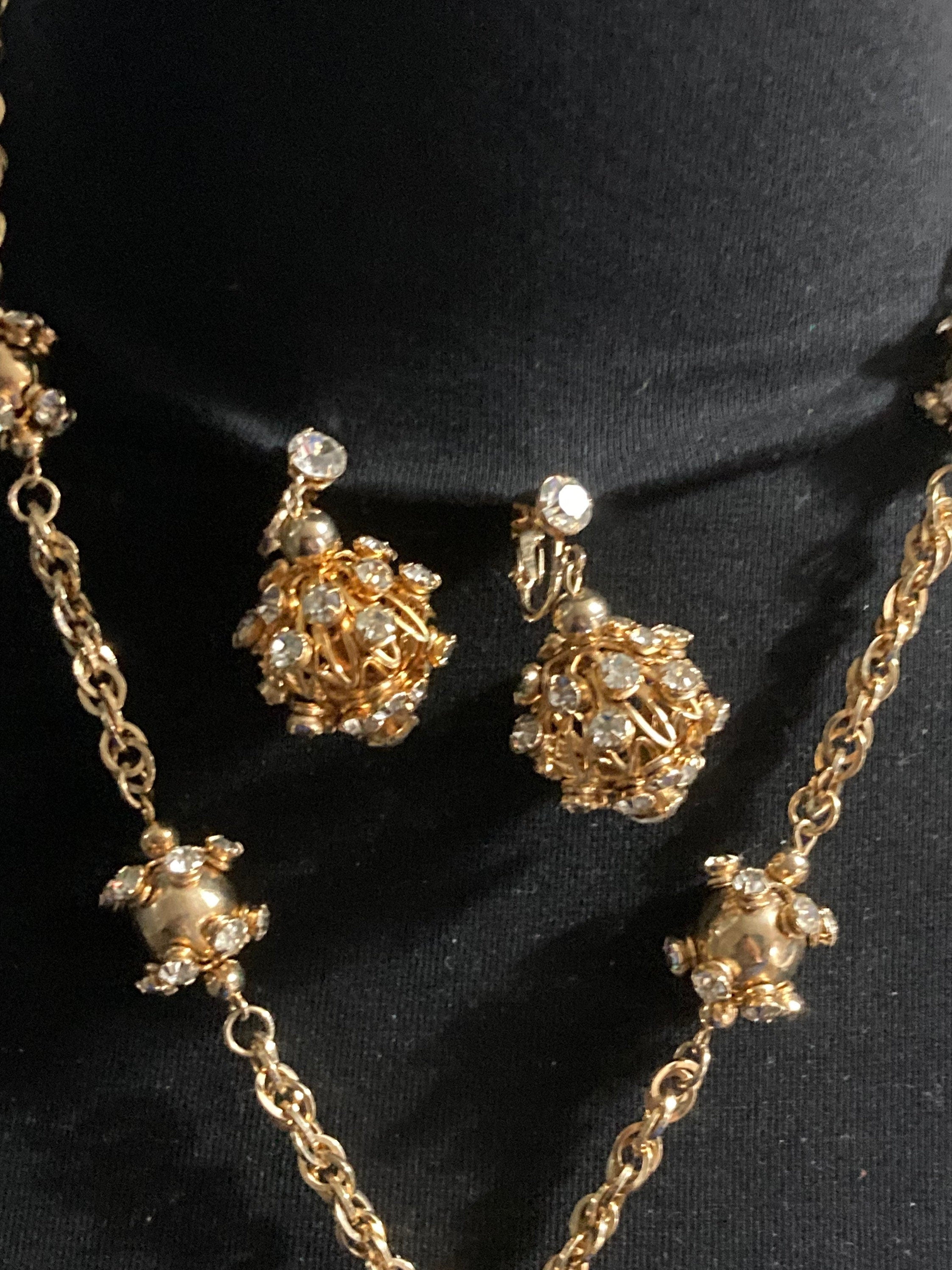 long gold tone rhinestone ball link soutoir knot necklace and matching clip earrings