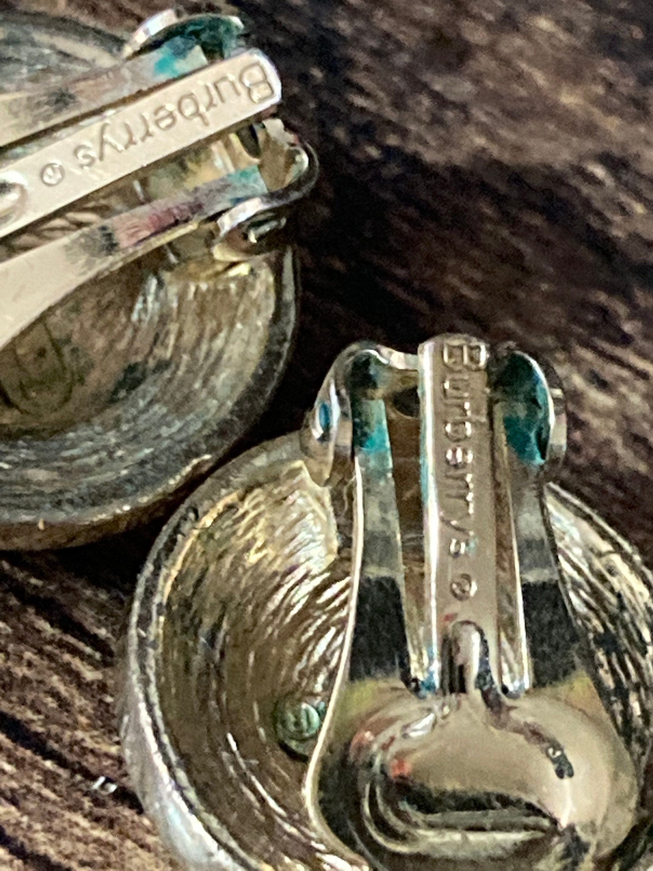 Signed BURBERRY diamanté gold and silver tone clip on stud earrings