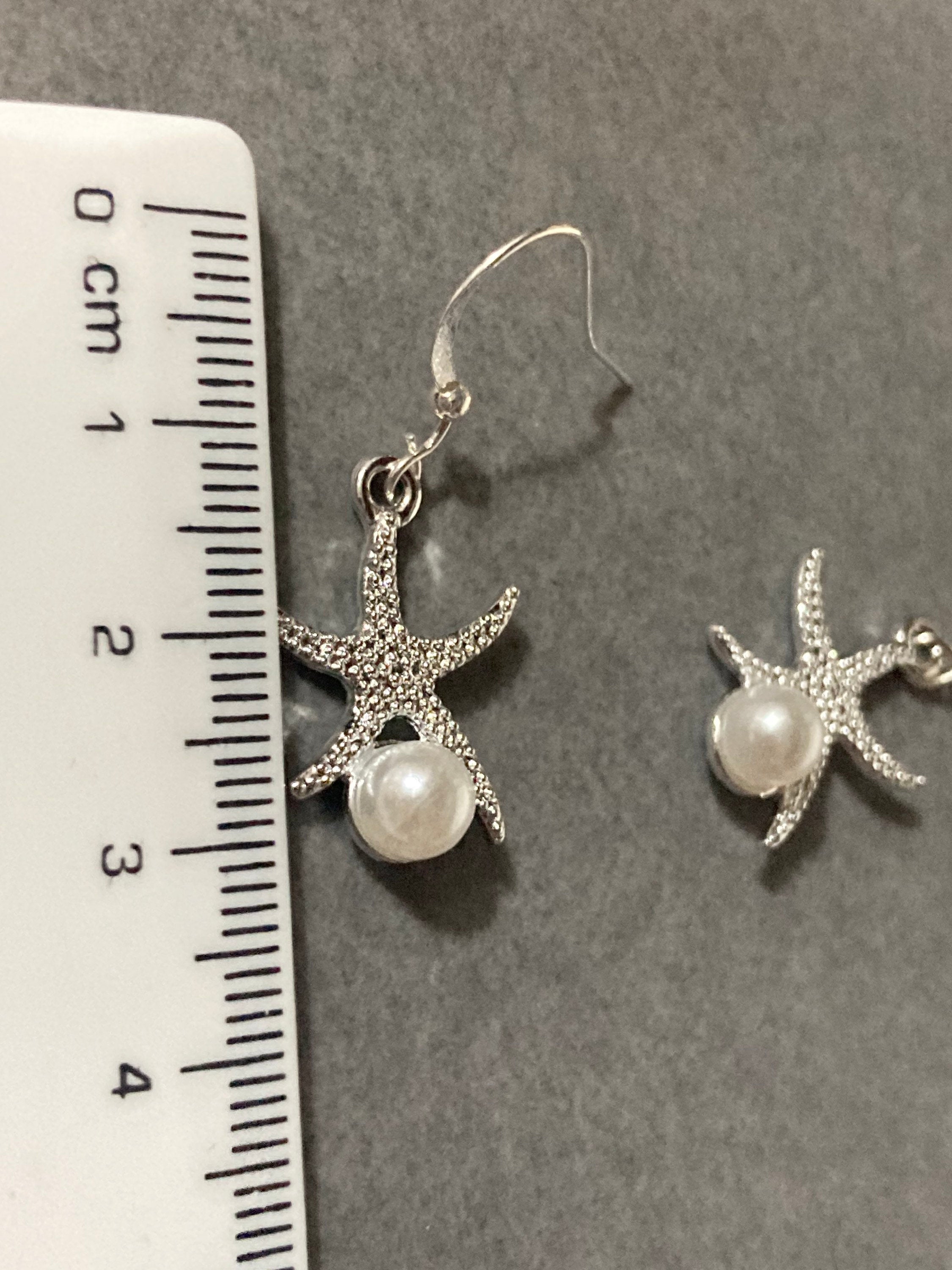 silve and pearl starfish earrings, pierced ears