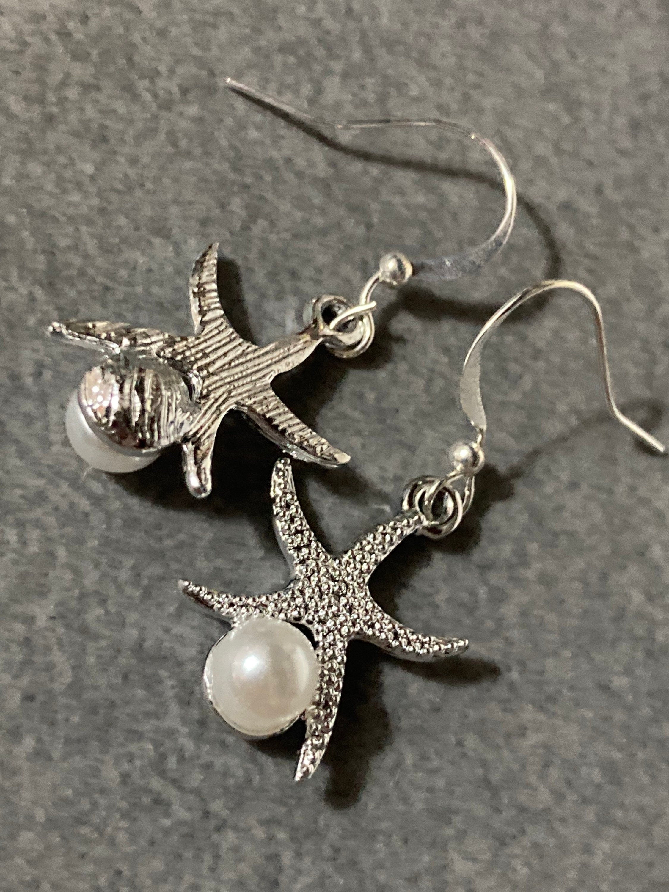 silve and pearl starfish earrings, pierced ears