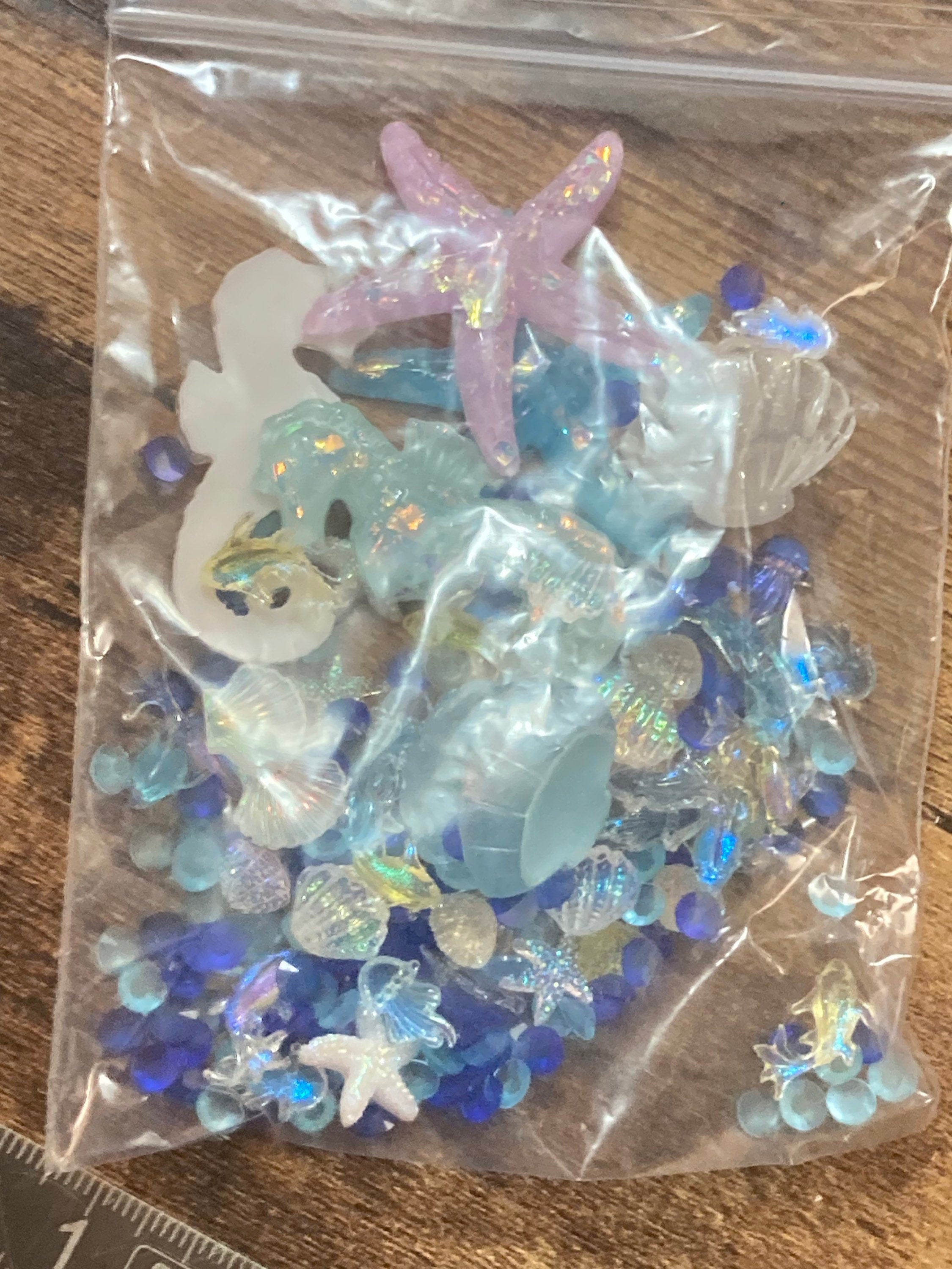 Mixed bag of sealife nautical fish, shells and starfish miniature plastic cabochons for craft