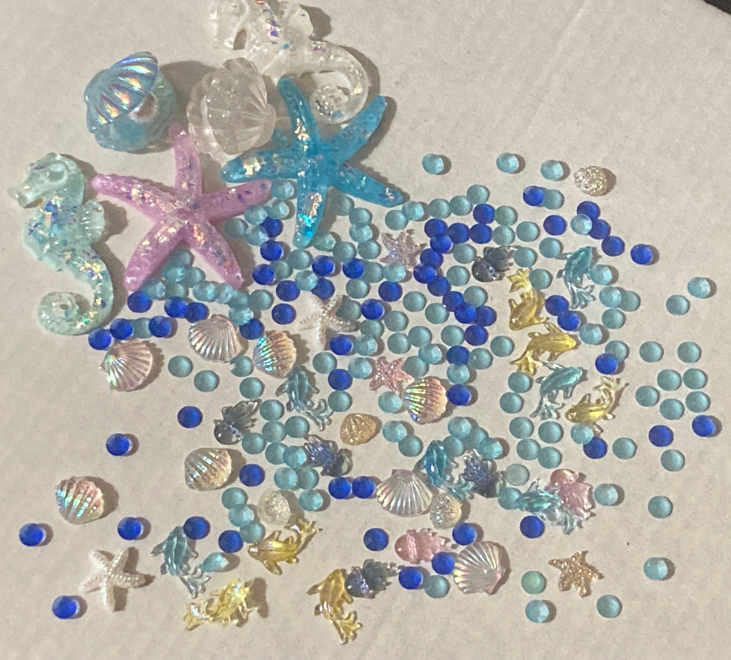 Mixed bag of sealife nautical fish, shells and starfish miniature plastic cabochons for craft