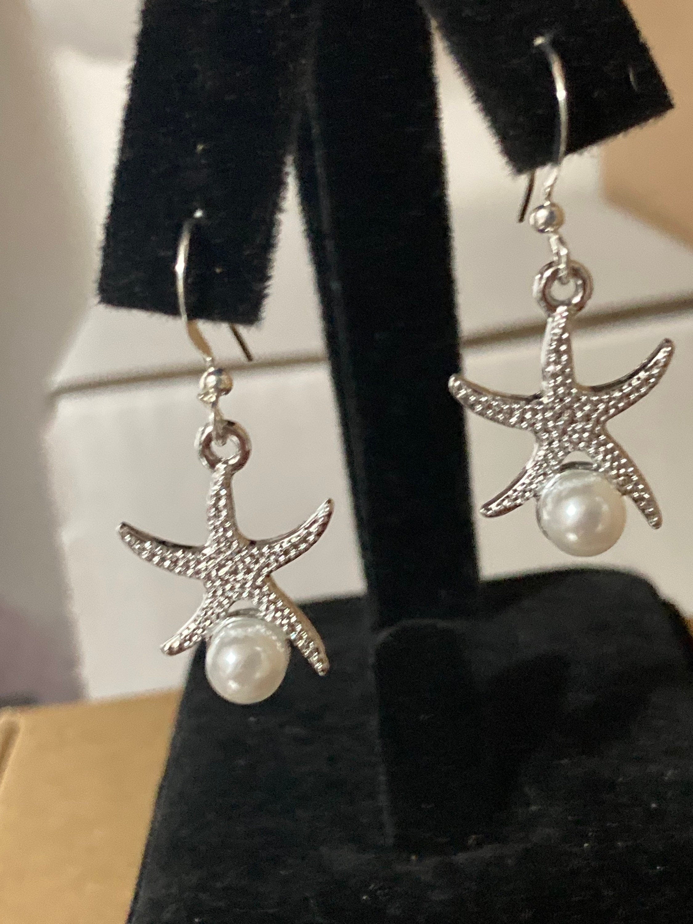 silve and pearl starfish earrings, pierced ears