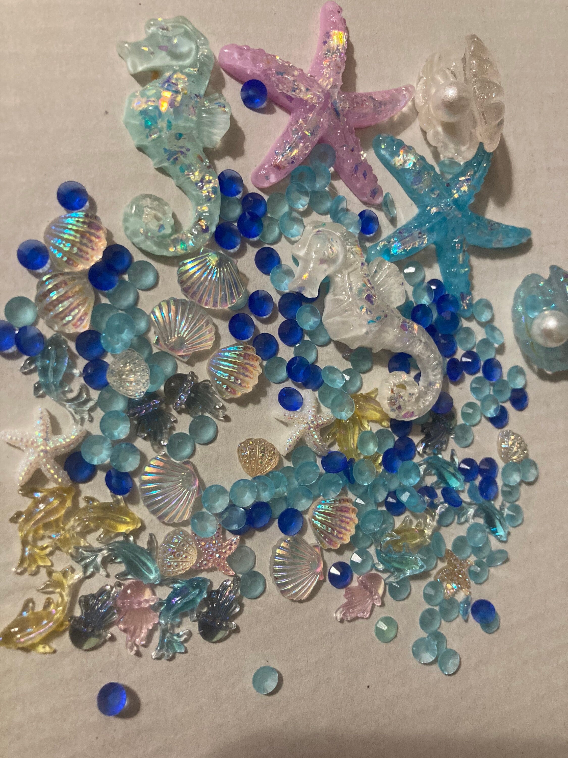 Mixed bag of sealife nautical fish, shells and starfish miniature plastic cabochons for craft
