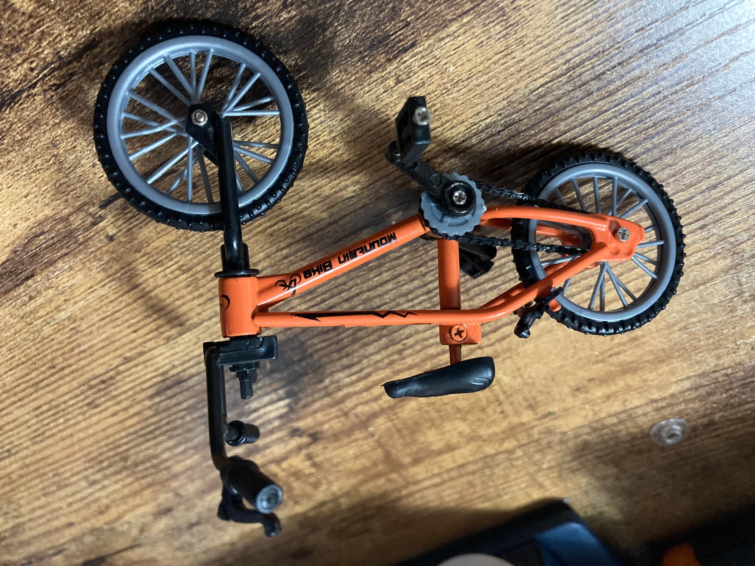 Miniature plastic orange mountain bike BMX cake topper decoration
