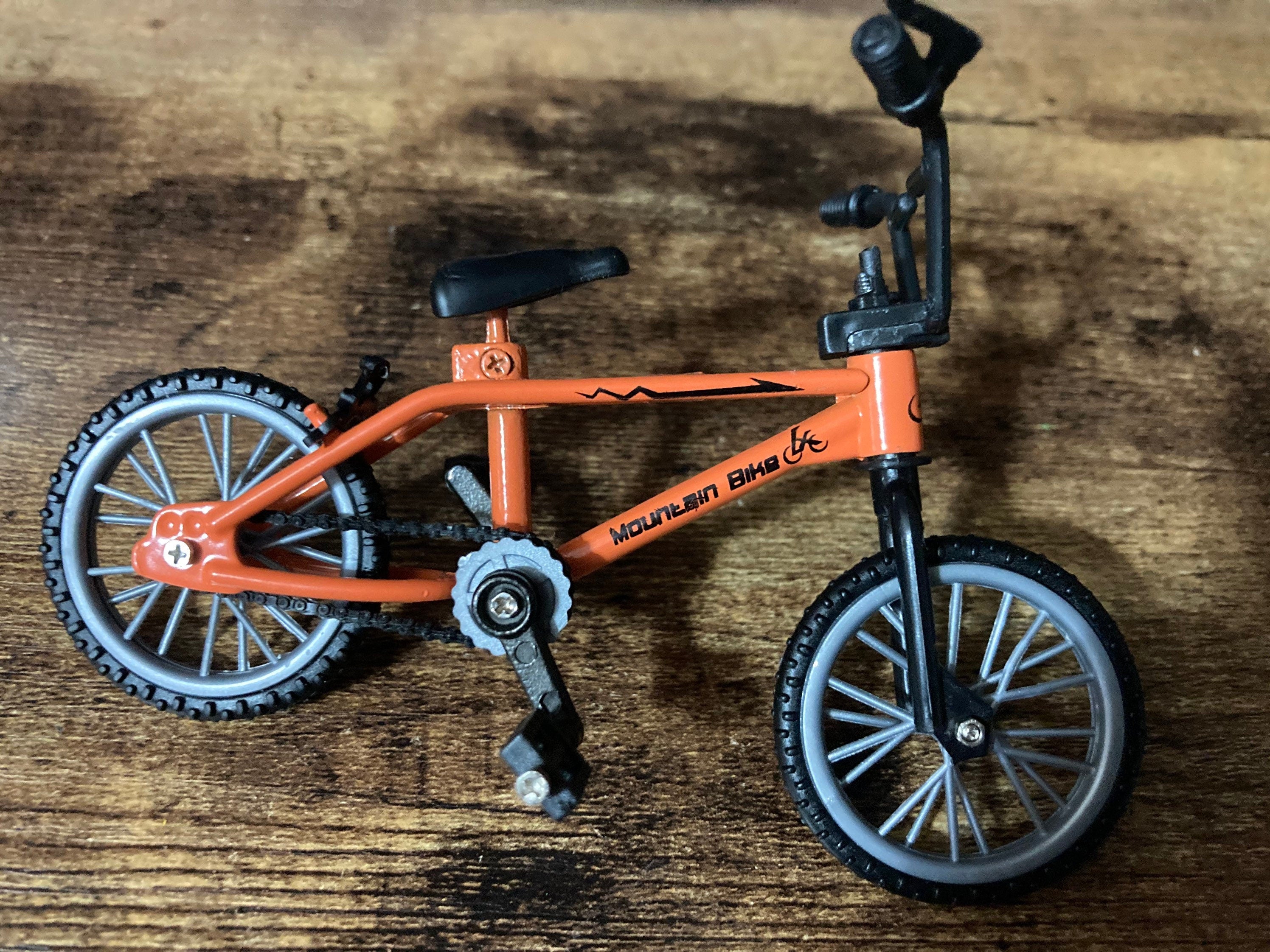 Miniature plastic orange mountain bike BMX cake topper decoration