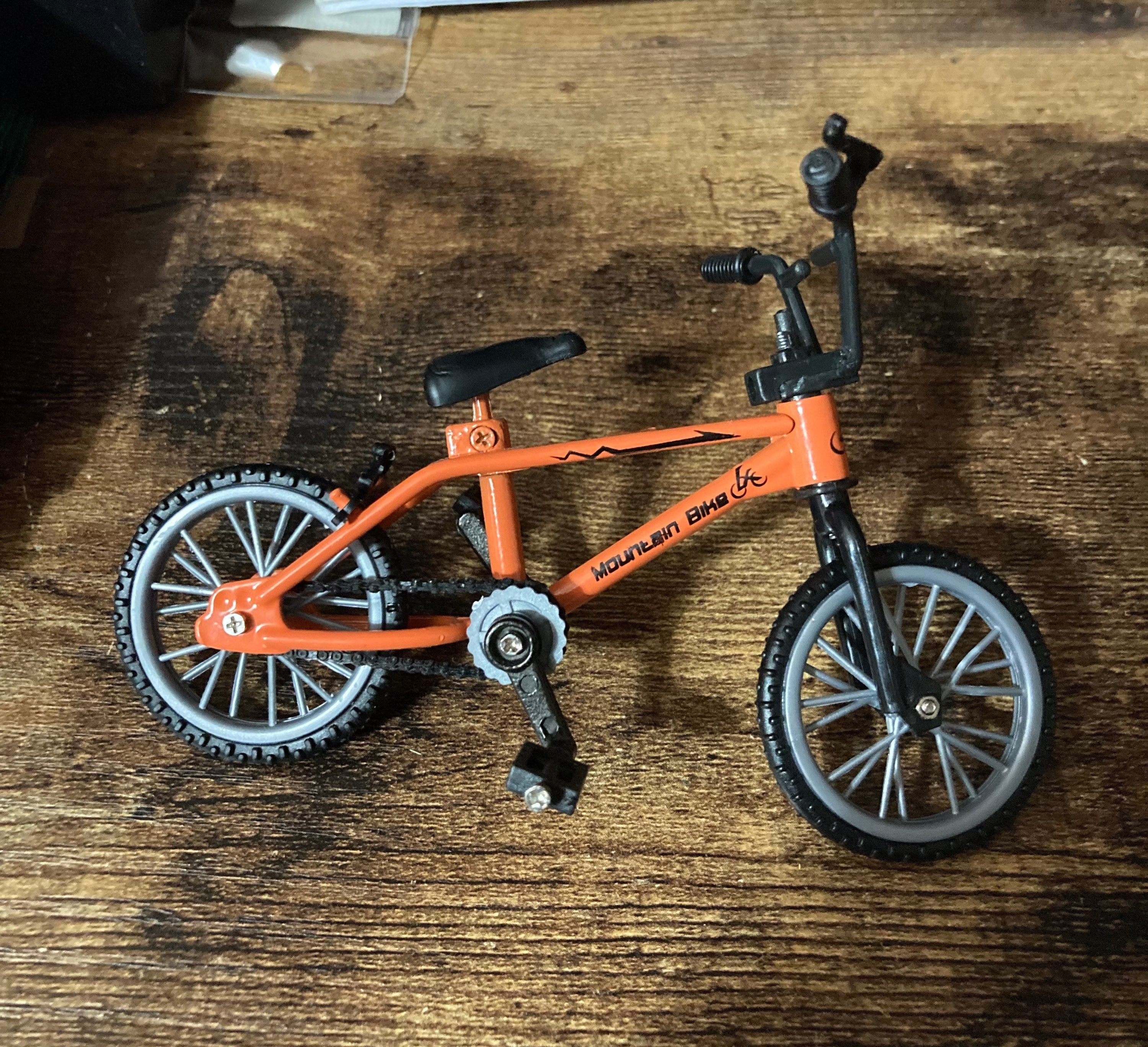 Miniature plastic orange mountain bike BMX cake topper decoration