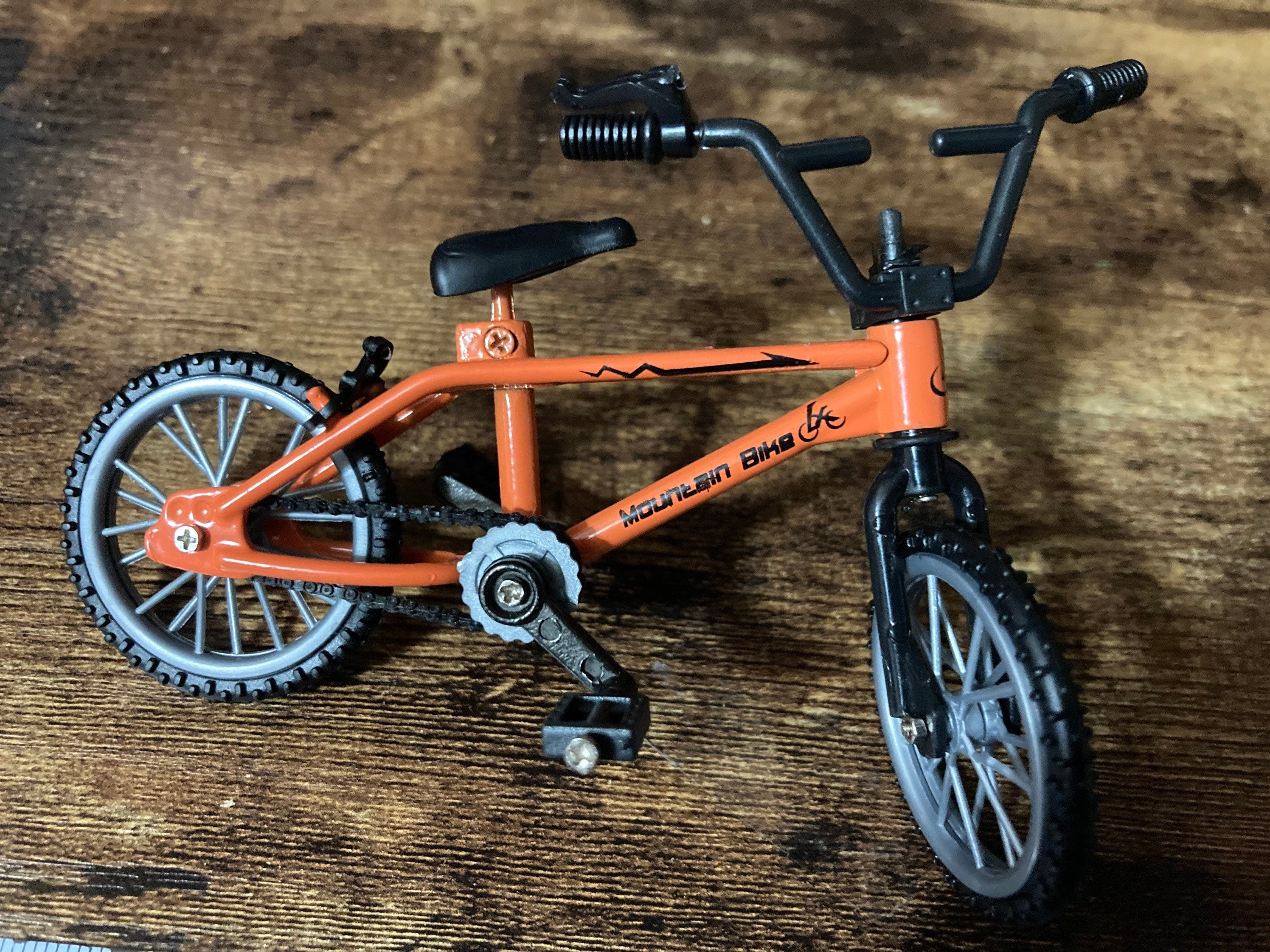 Miniature plastic orange mountain bike BMX cake topper decoration