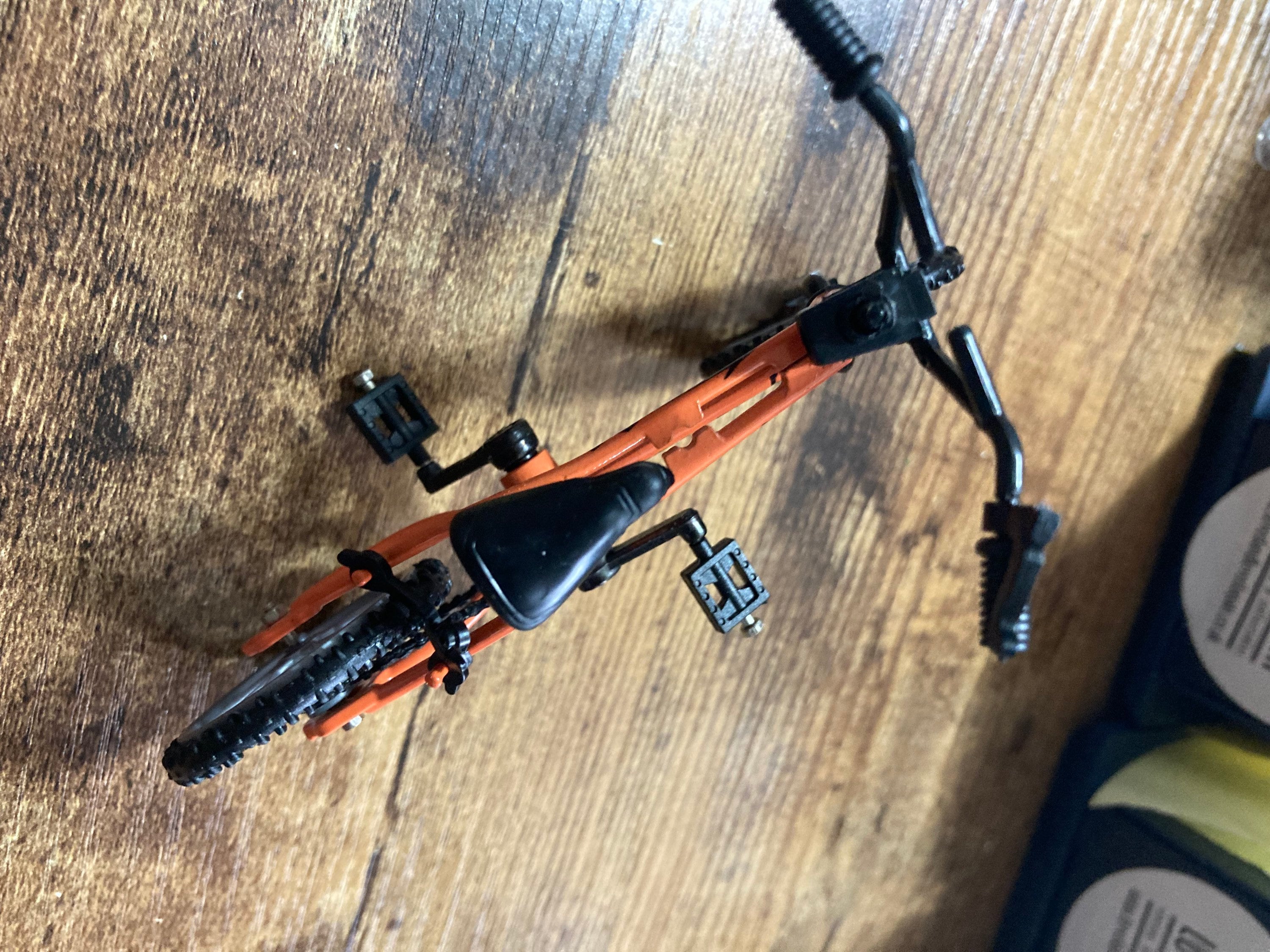 Miniature plastic orange mountain bike BMX cake topper decoration