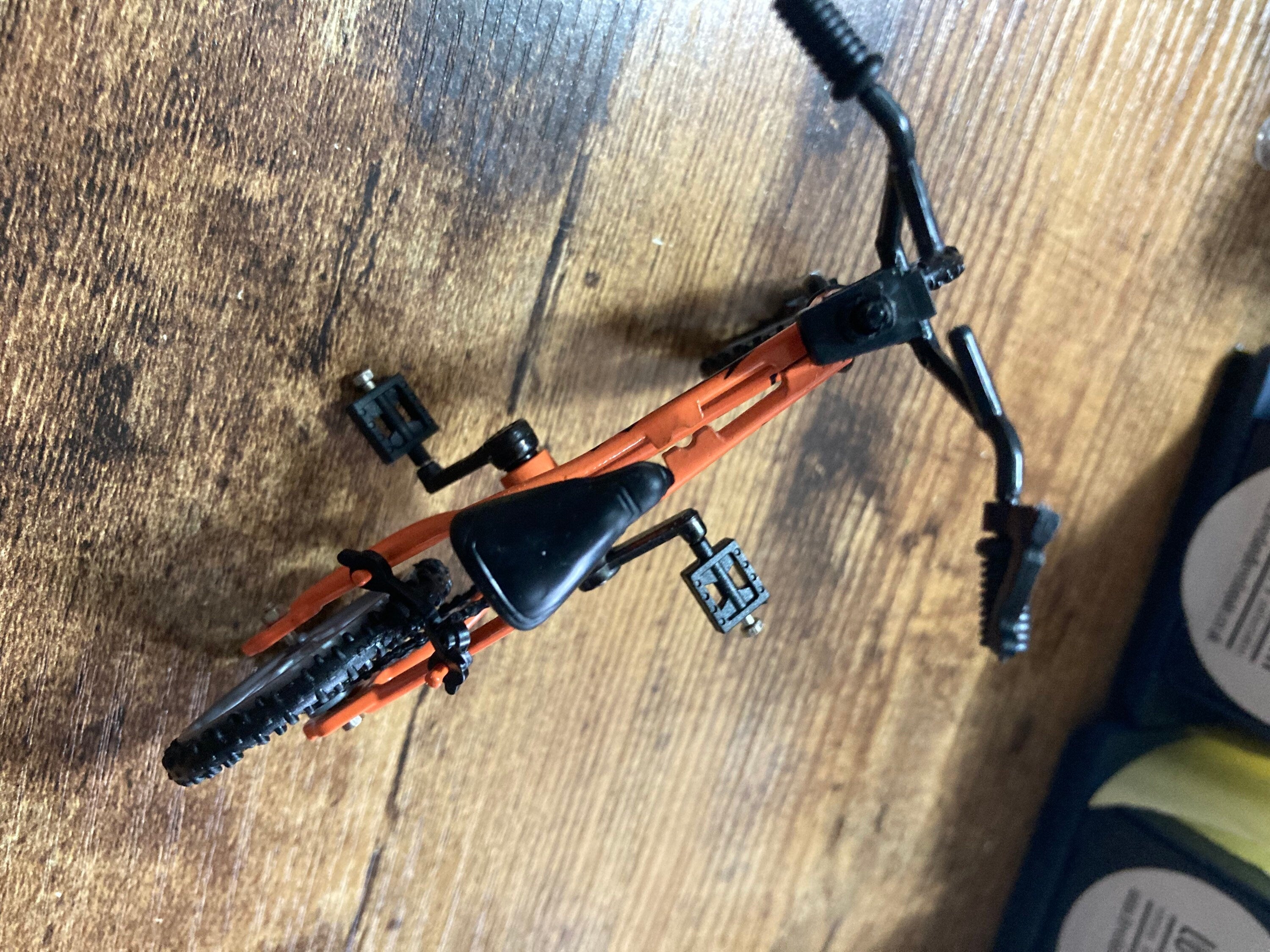 Miniature plastic orange mountain bike BMX cake topper decoration