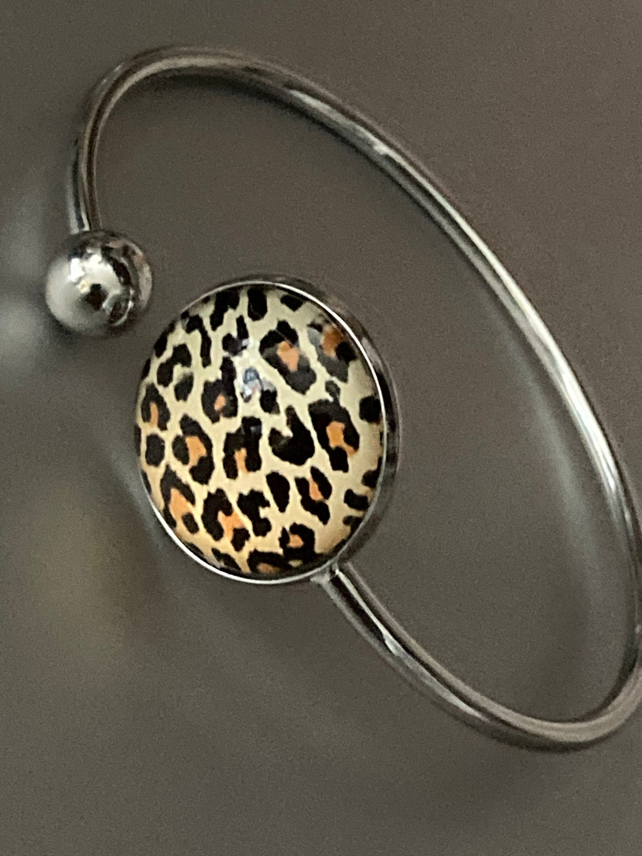Leopard print cabochon bangle bracelet, stainless steel glass