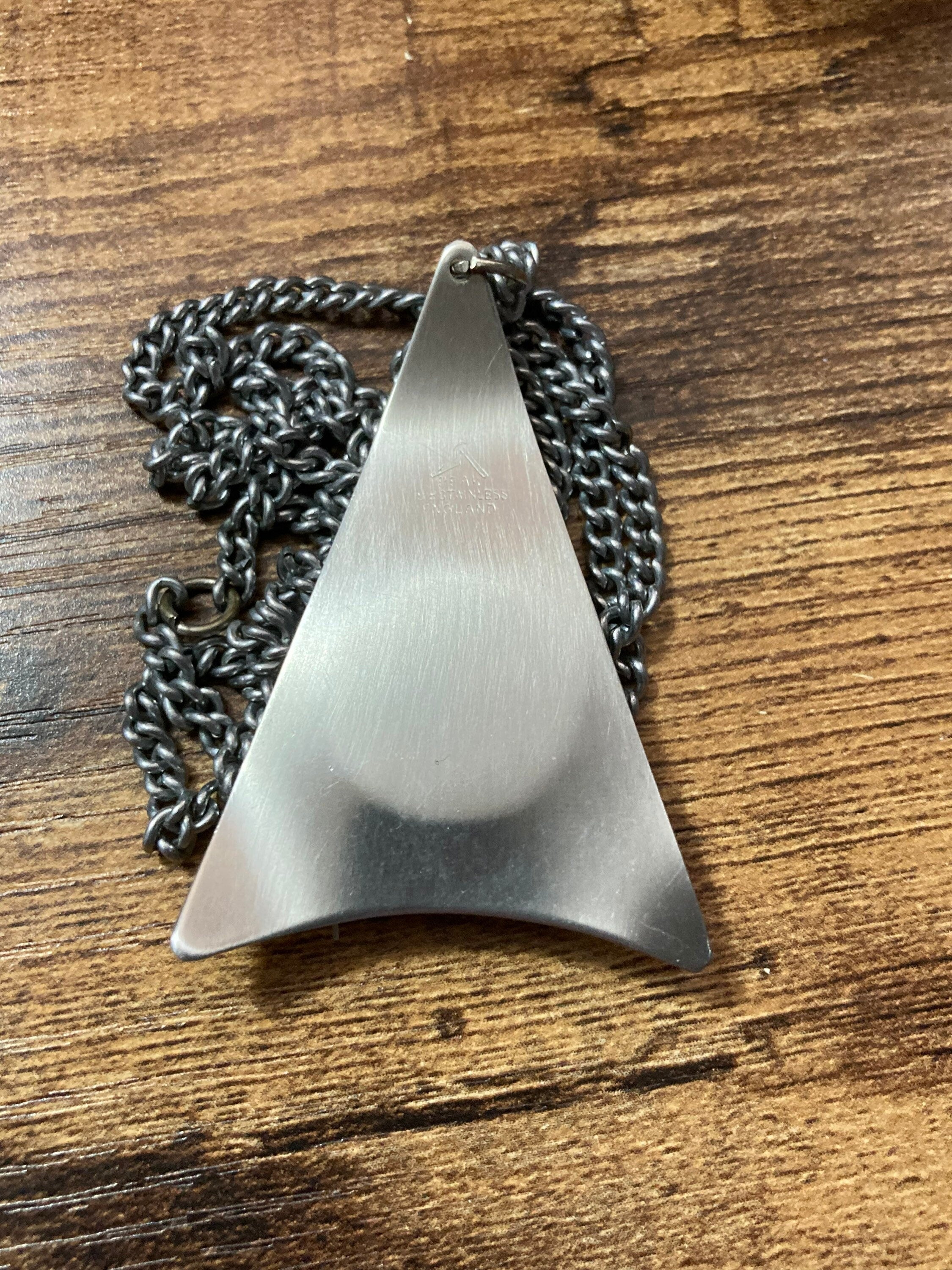 Vintage Modernist stainless steel pendant necklace with central pale pink cabochon